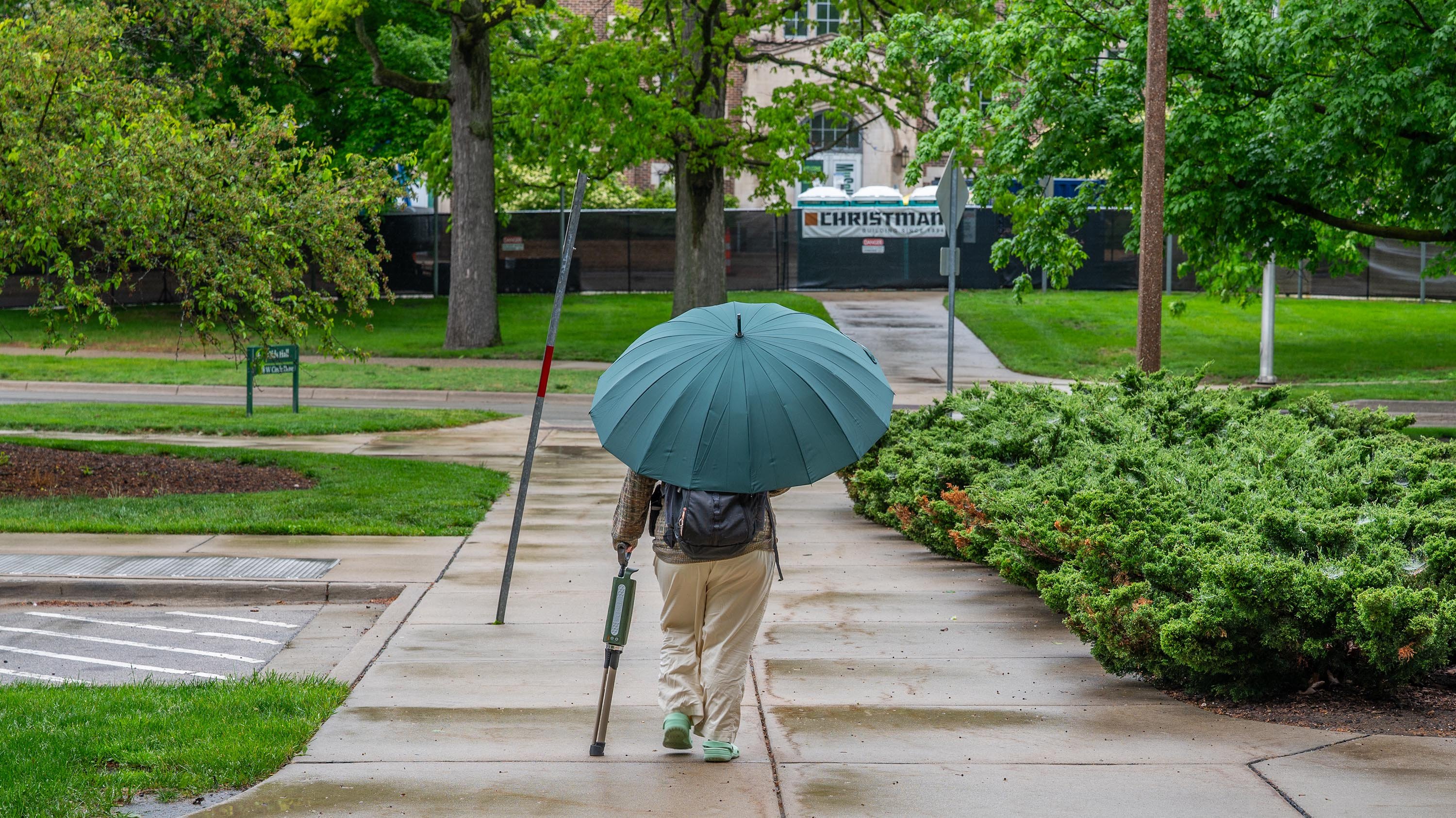 Person walking with an umbrella