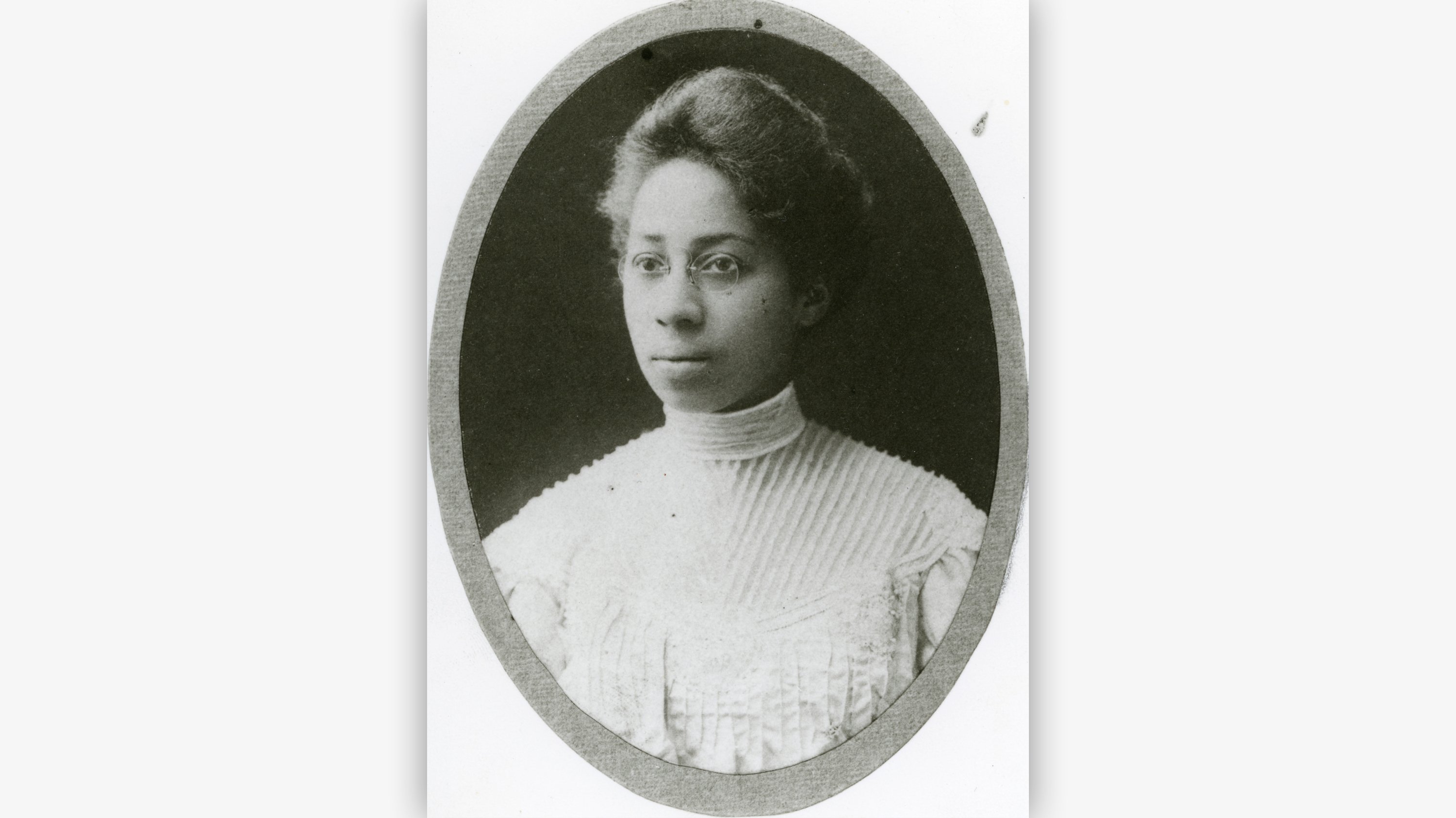 A sepia-toned portrait of a woman.