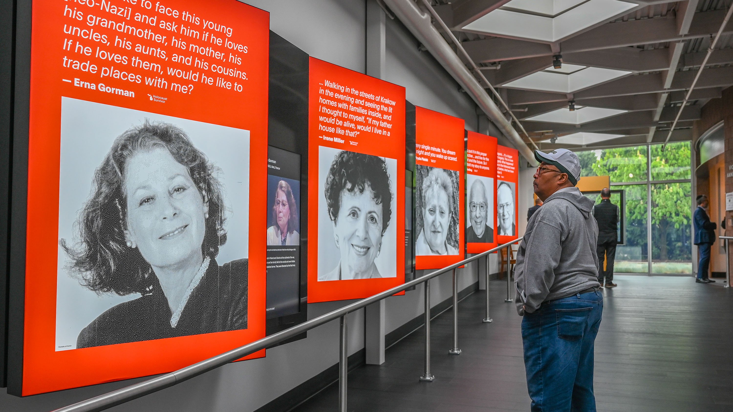 A man walks through a museum exhibition. 