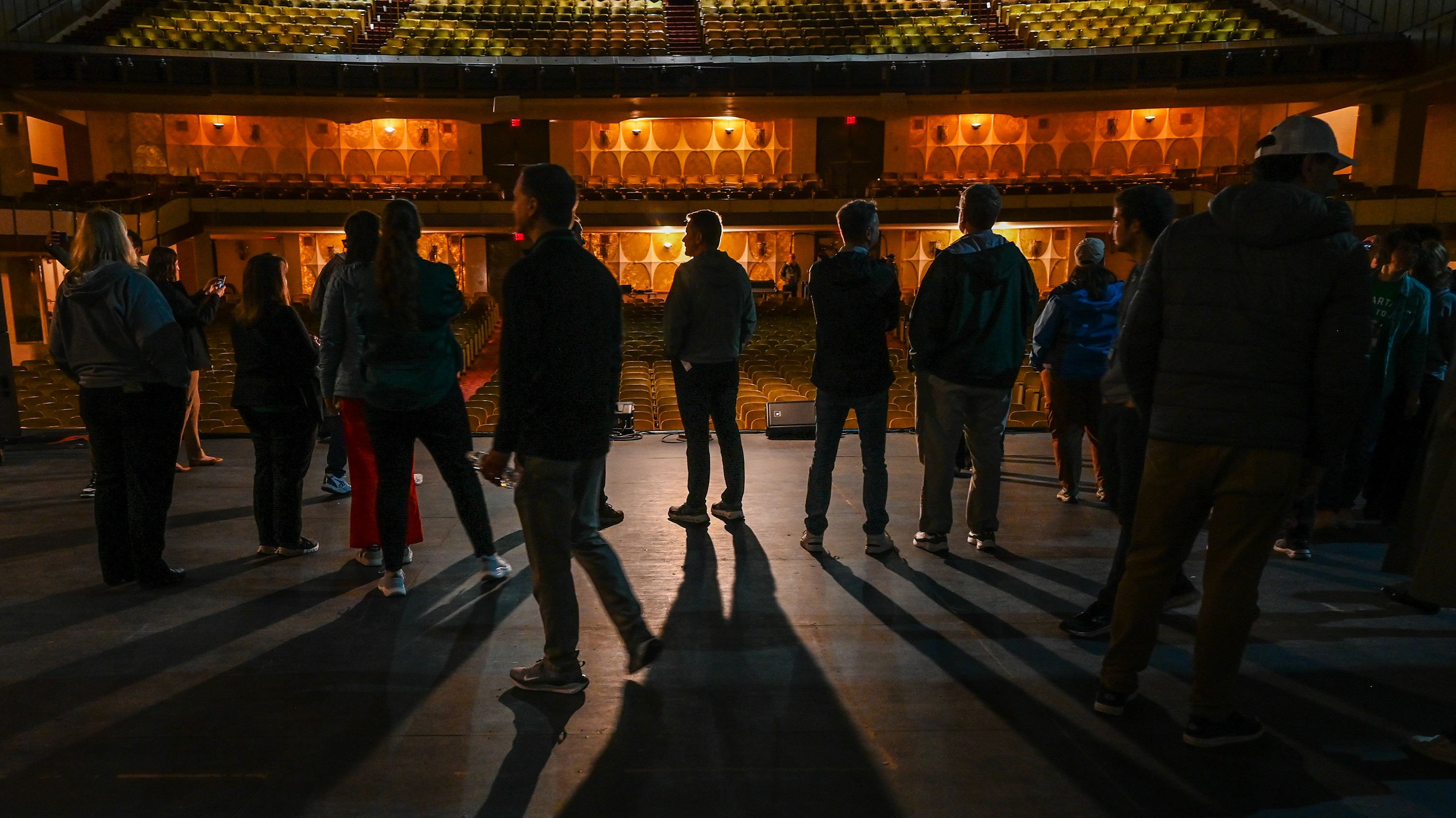 Shadows of people on stage