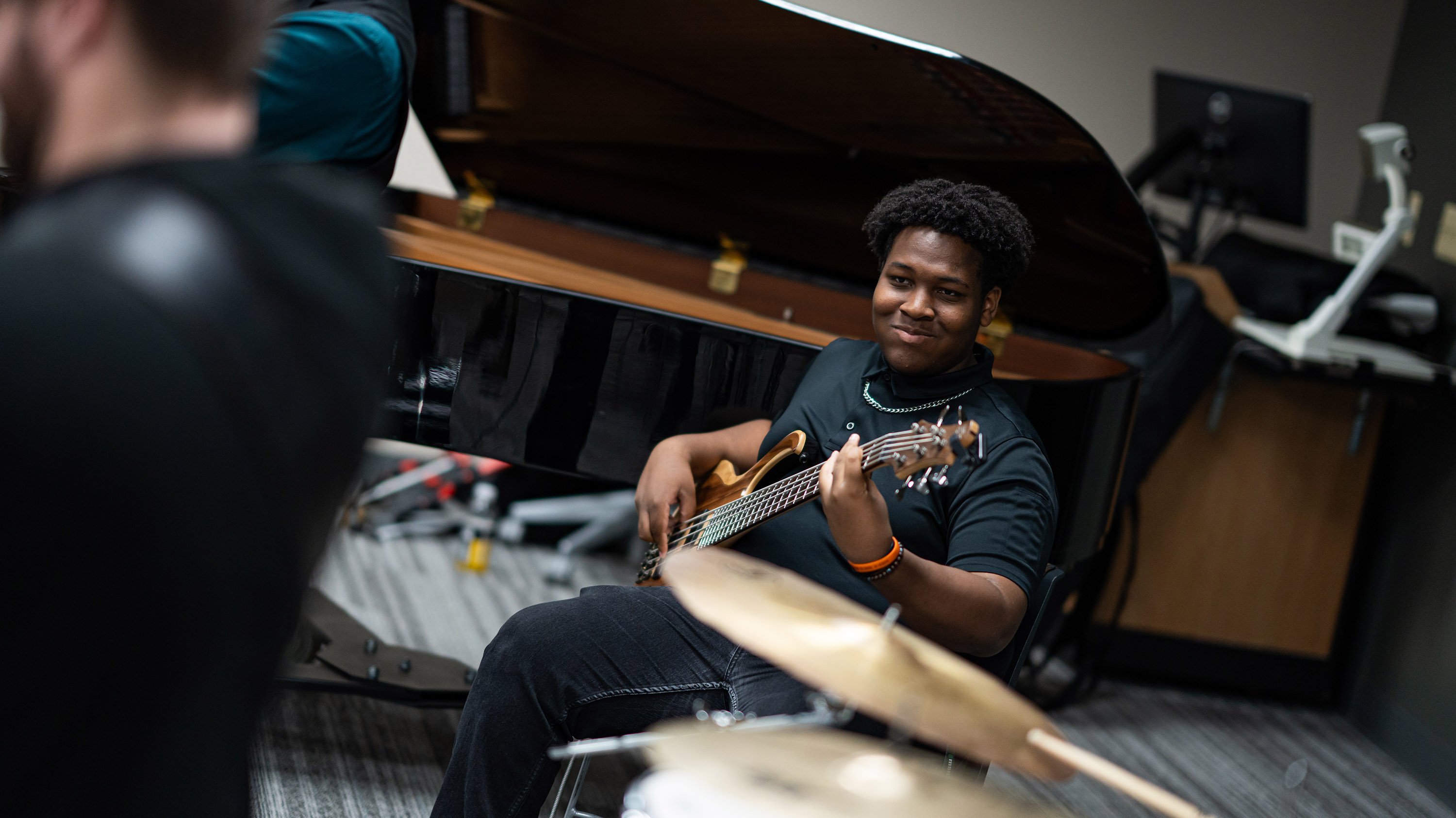 A person playing bass guitar