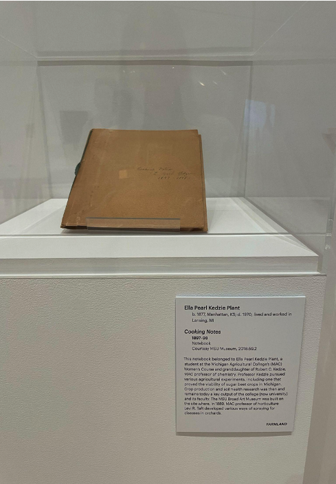 a closed notebook on a display pedestal
