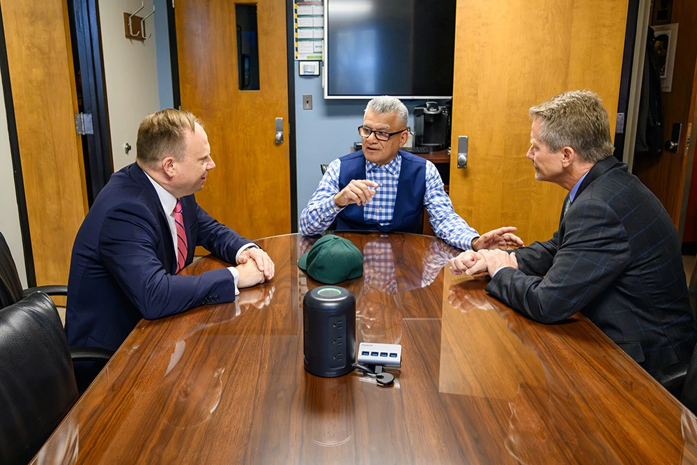 3 men discussing