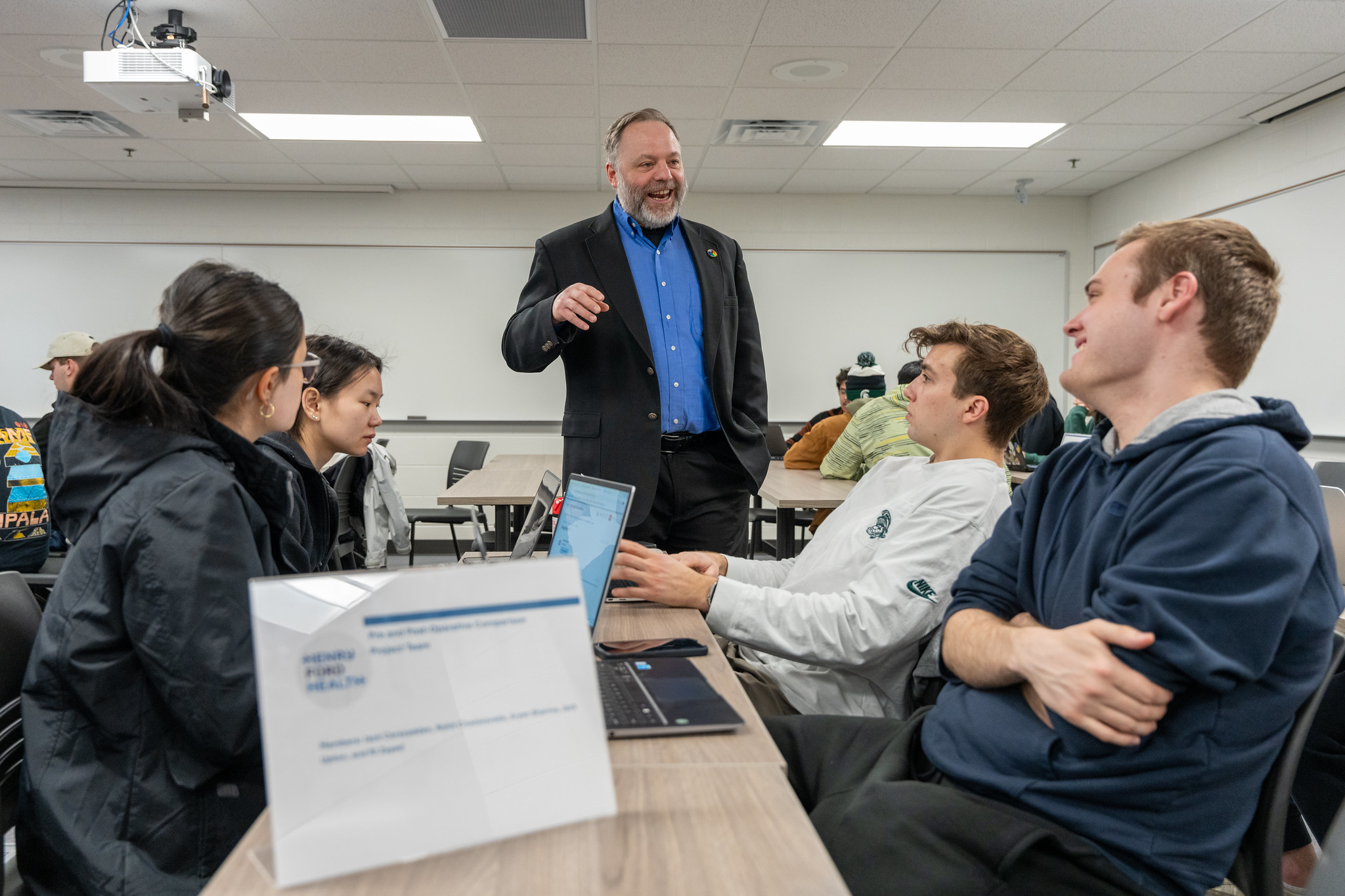 Dirk Colbry, senior specialist in the Computational Mathematics, Science and Engineering Department, answers a student’s question during a data science capstone class. Photo credit: Paul Henderson