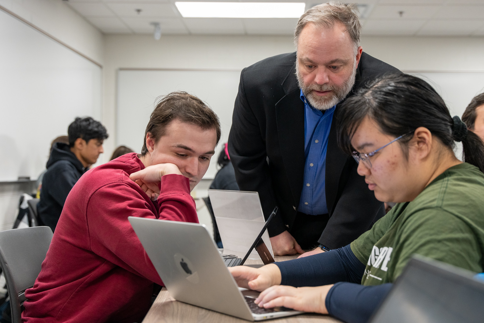Dirk Colbry, senior specialist in the Computational Mathematics, Science and Engineering Department, answers a student’s question during a data science capstone class. Photo credit: Paul Henderson