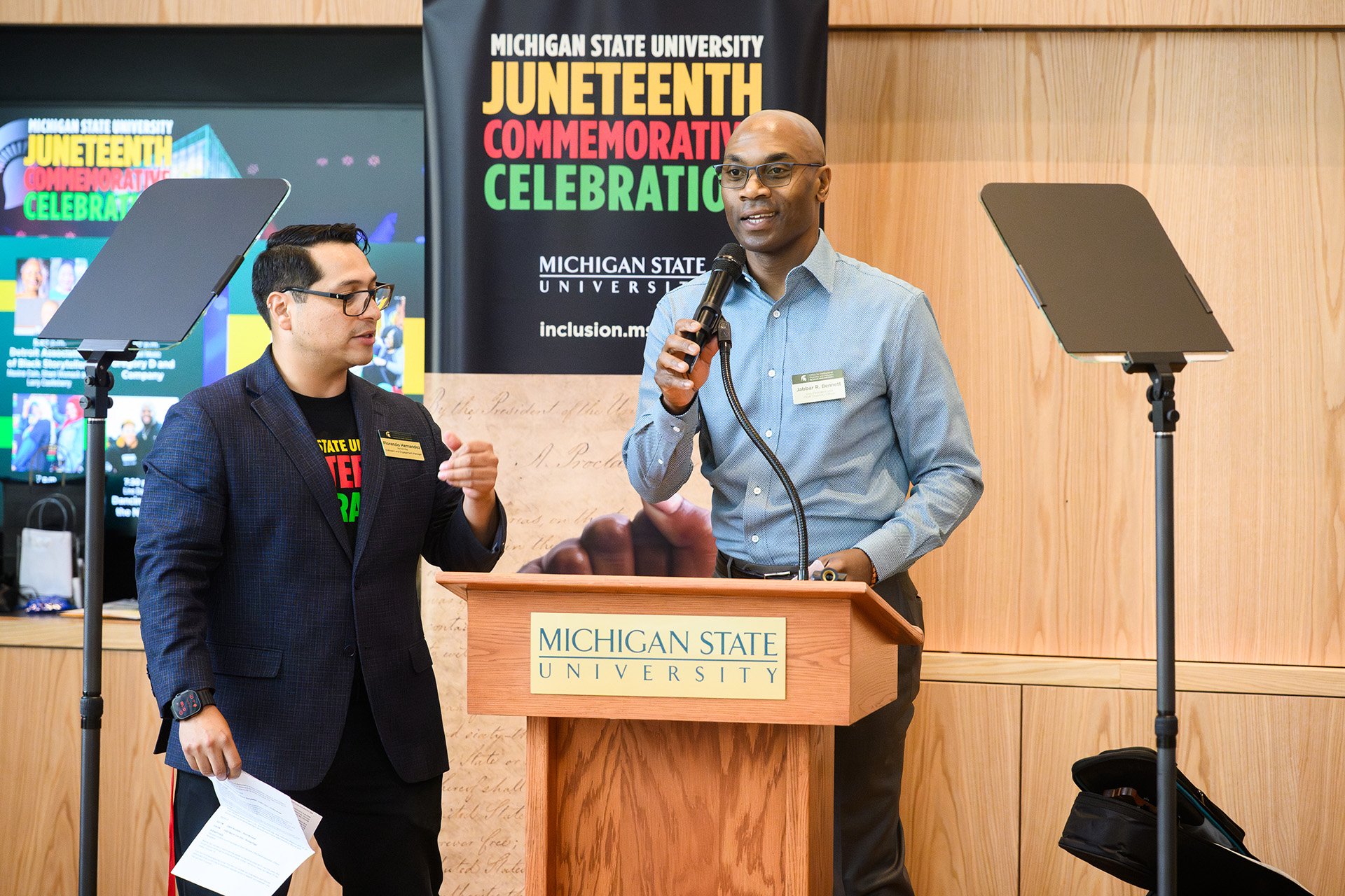 Jabbar Bennett speaks at the lectern at the MSU Juneteenth Celebration