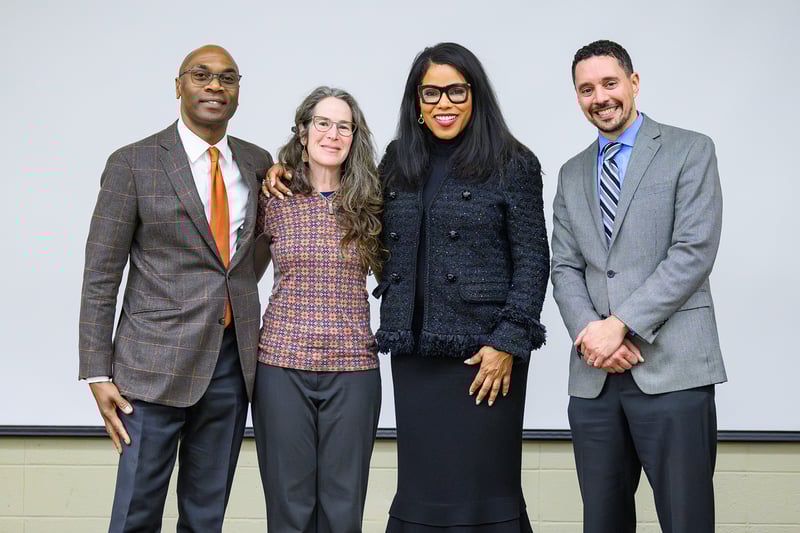 Malcolm X Community Forum speakers pose for a picture