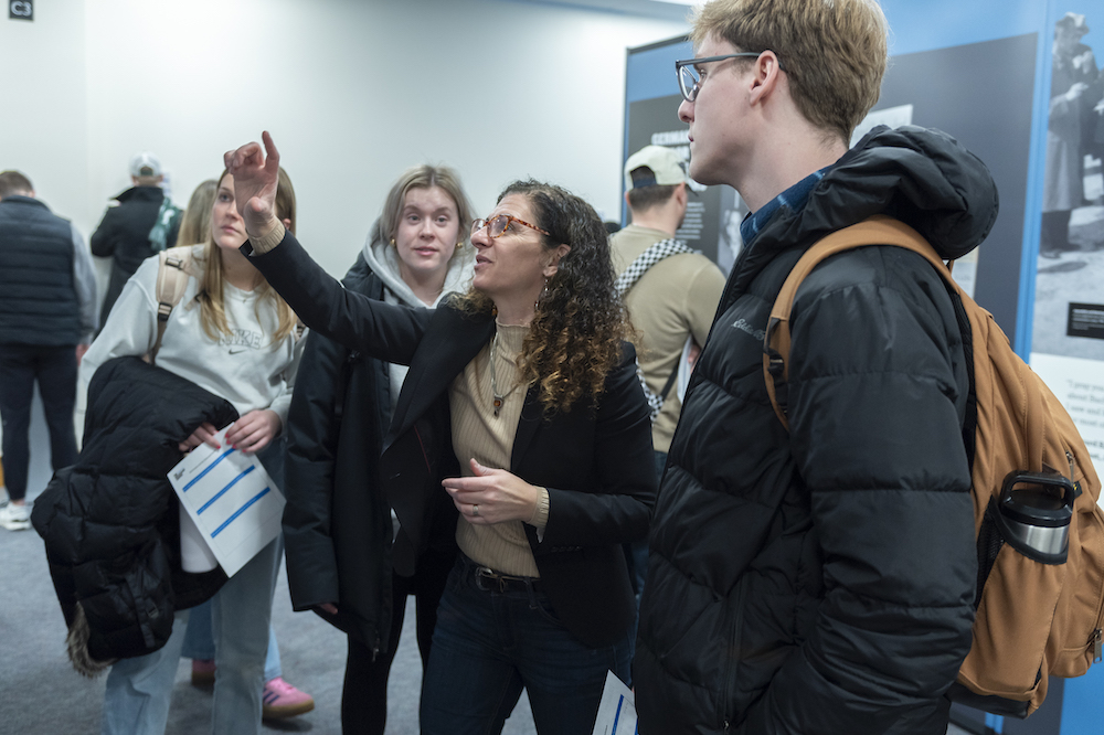 Professor Kirsten Fermaglich talks with students. Credit Jackie Hawthorne.