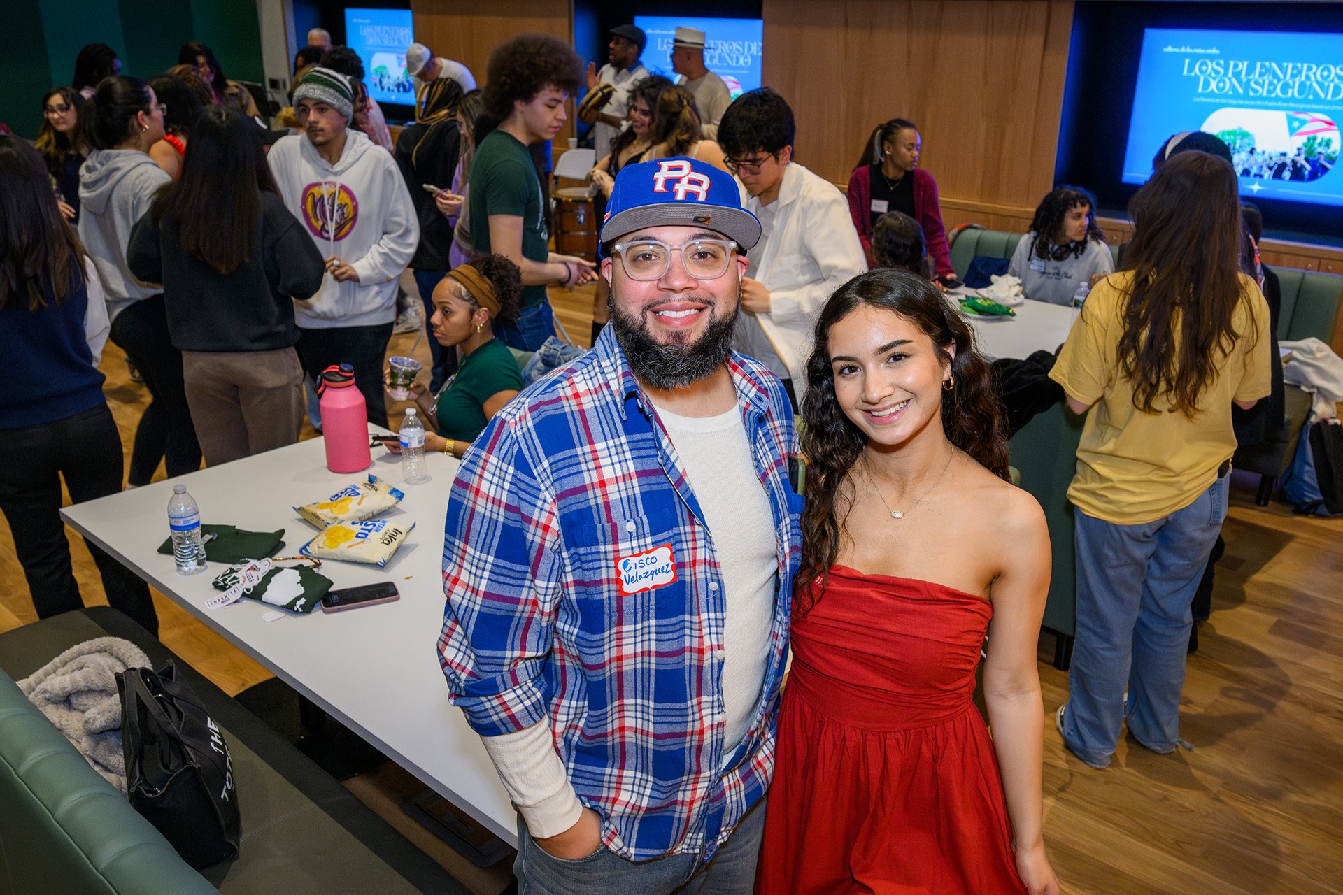 A man and woman smile in a photo