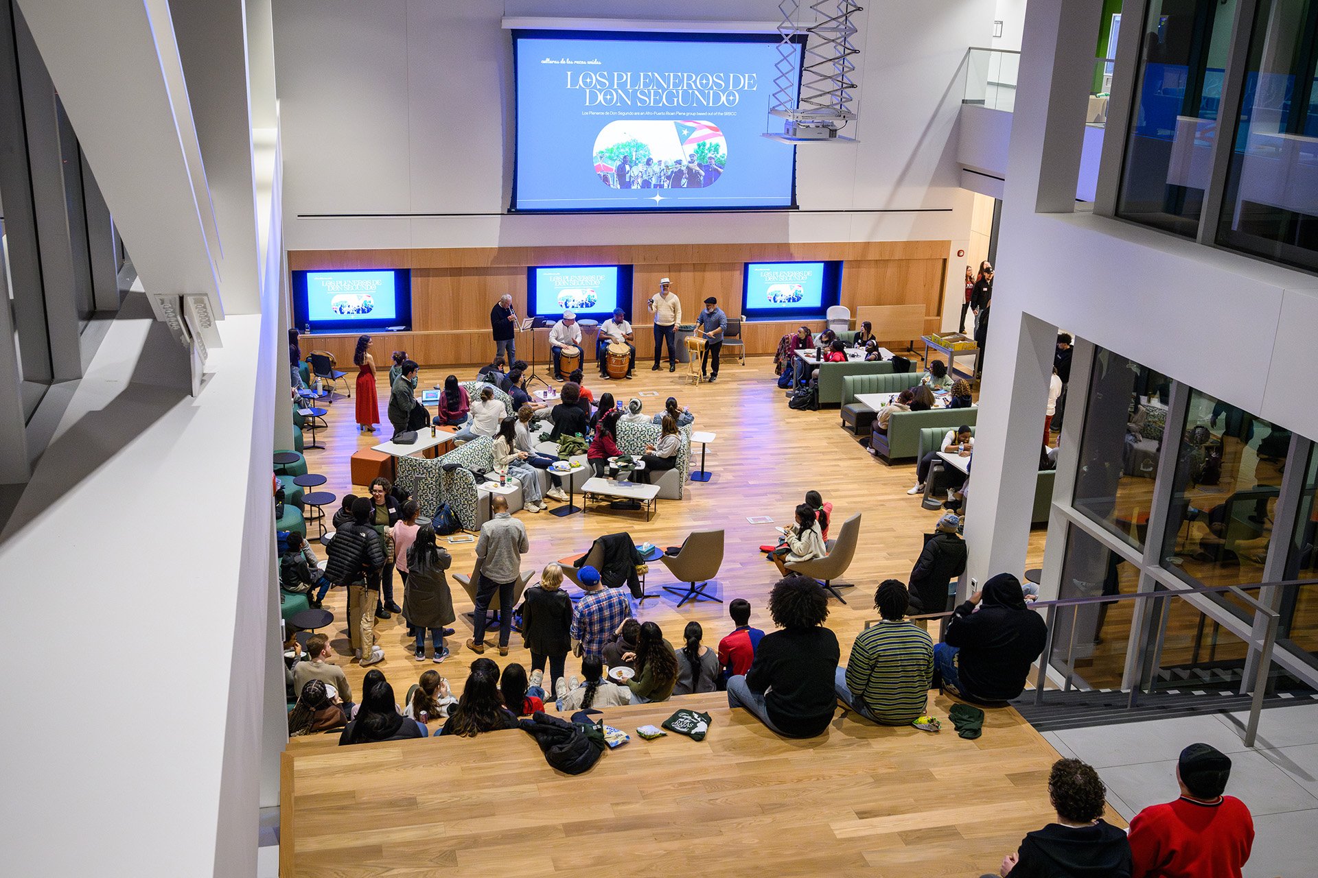 students gather and sit on stairs