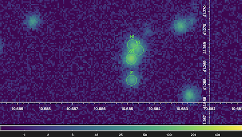 An image of four sources of X-rays — S1, SSS, N1, and P2 — from the center of the Andromeda galaxy.
