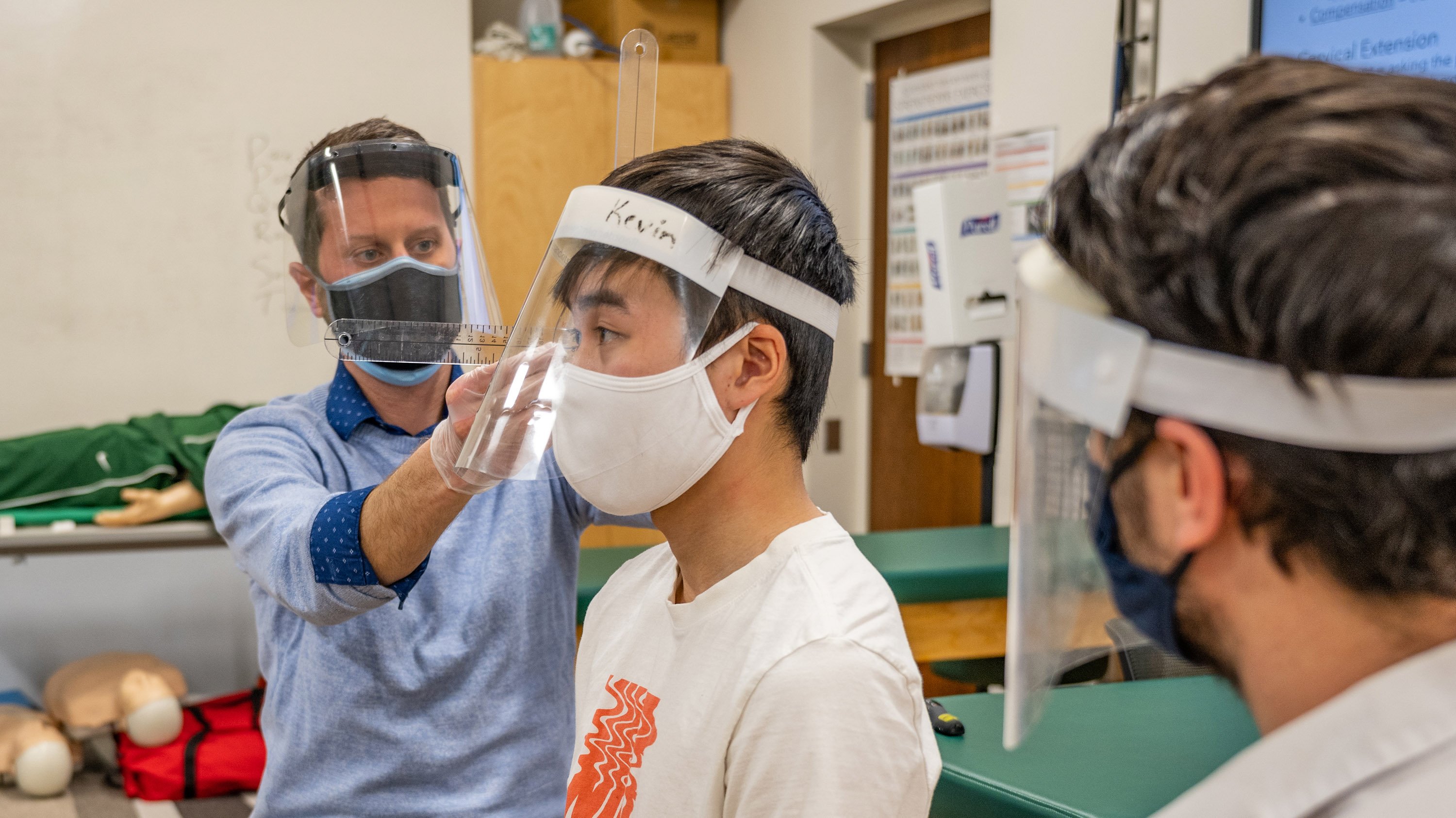 Students and professor in kinesiology class