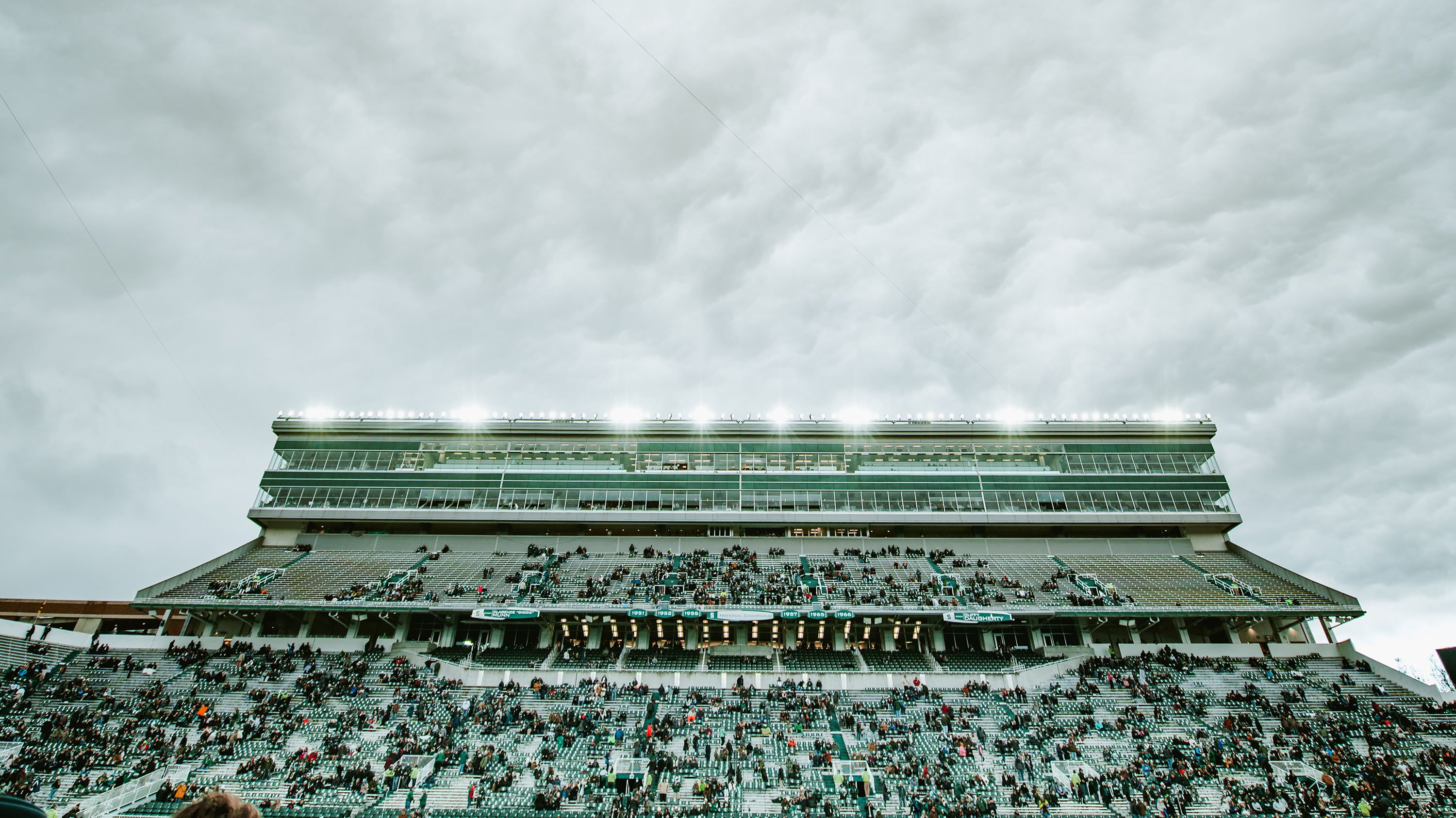 Spartan Stadium on gameday, with cloudy skies behind it