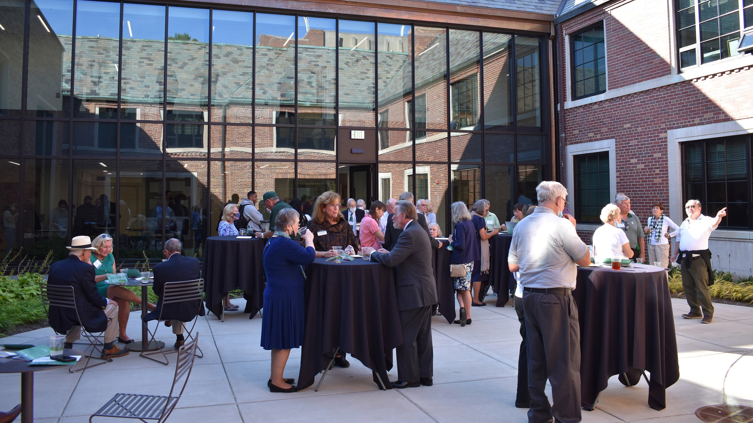 Ribbon-cutting attendees in the Simon courtyard