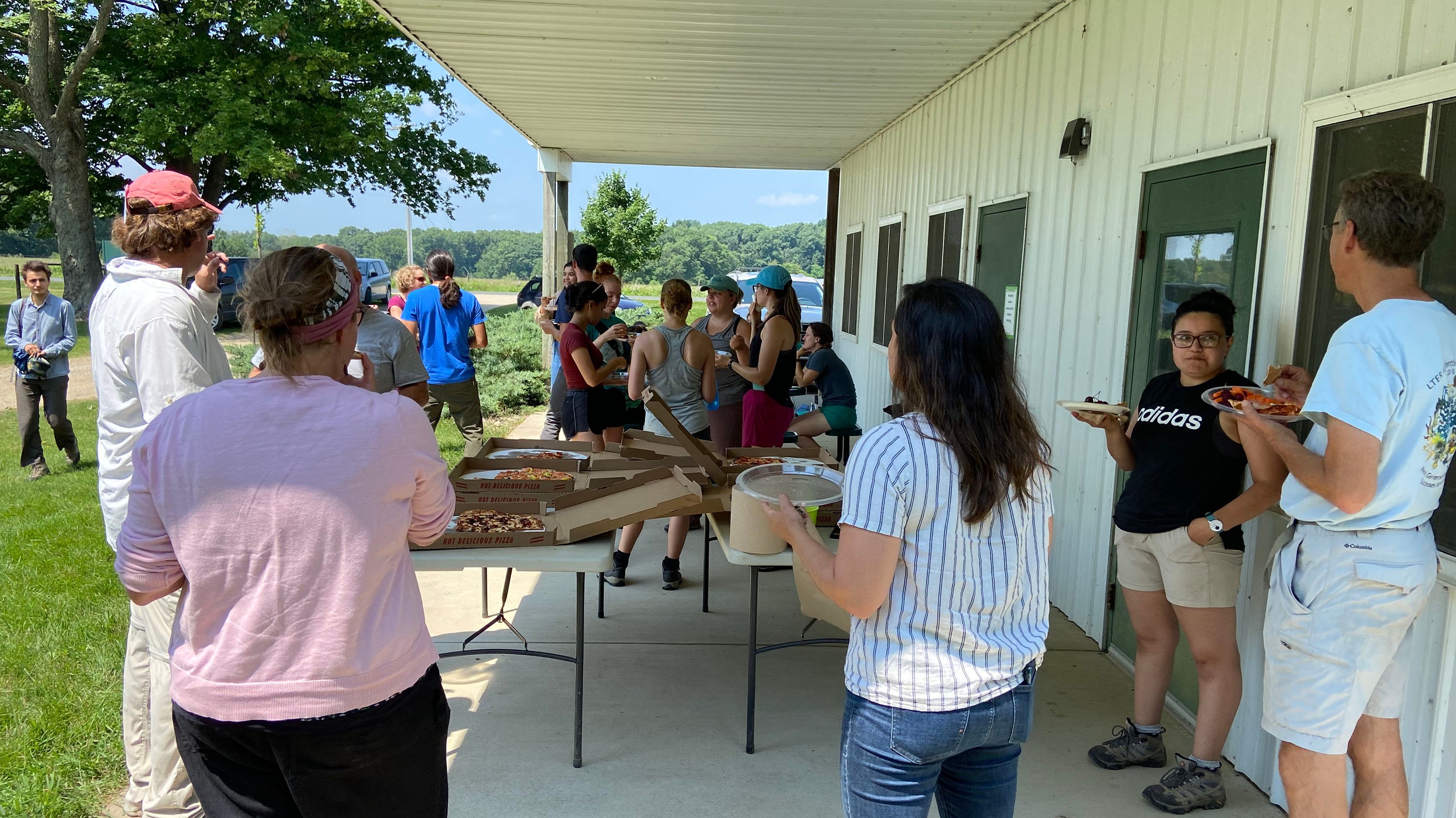Members of the Haddad lab eating pizza at KBS