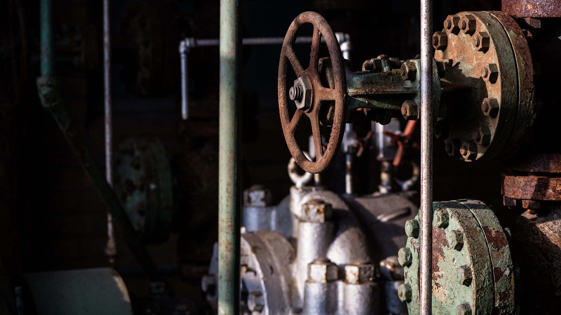 A 2018 photo shows handwheels, valves and flanges in the decommissioned Shaw Lane Power Plant. 