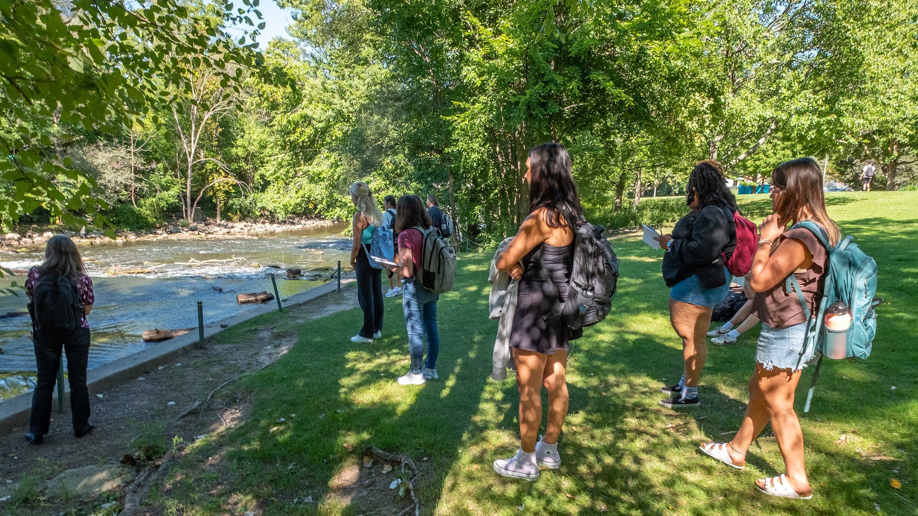 Students looking at Red Cedar