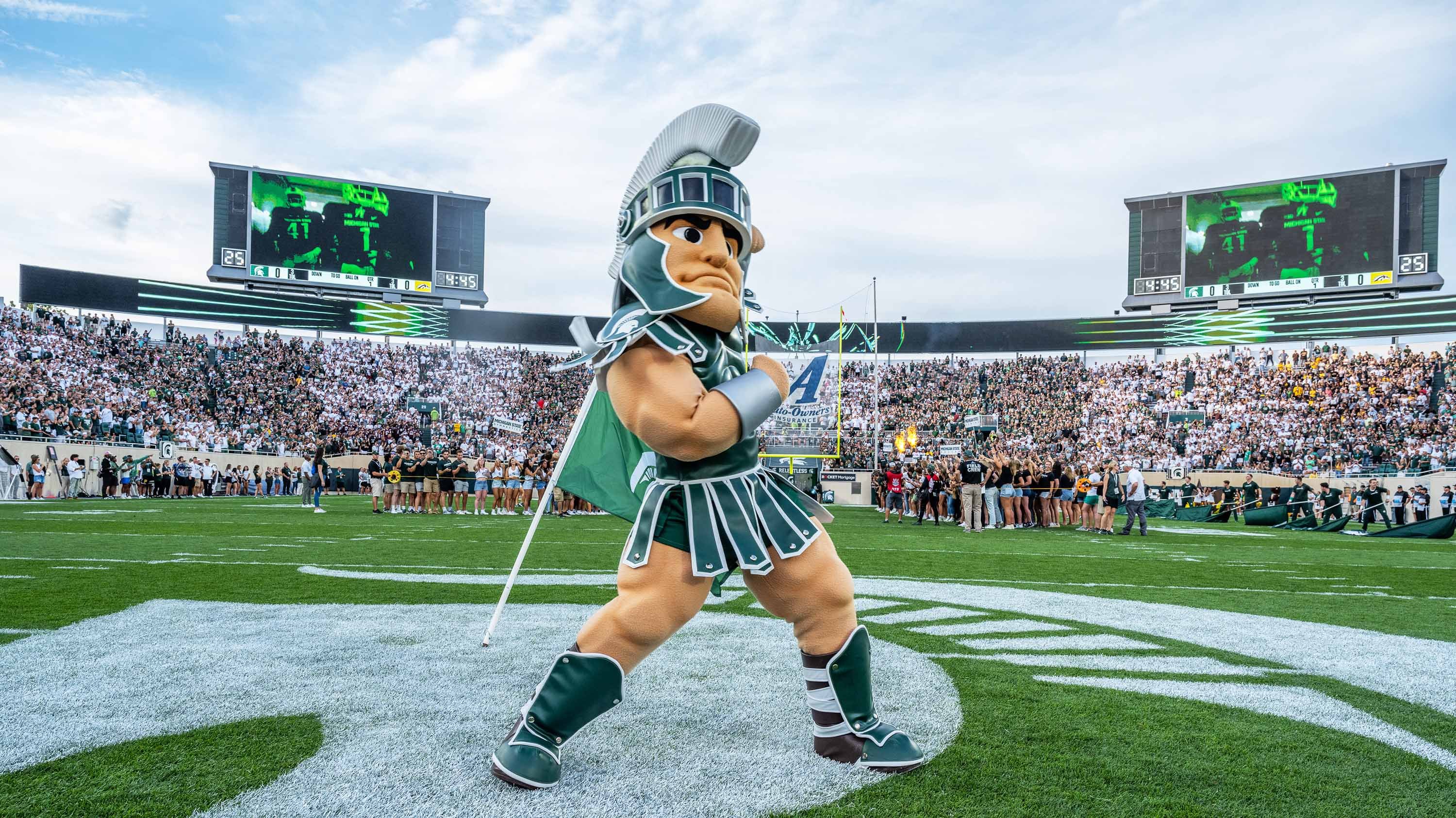 Sparty mascot posing in Spartan Stadium