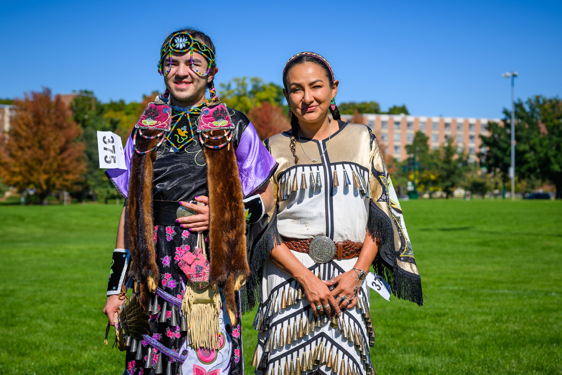 Dancers Jamie John, on left, and Tera John of the Grand Traverse Band of Chippewa Indians in a jingle style dress.