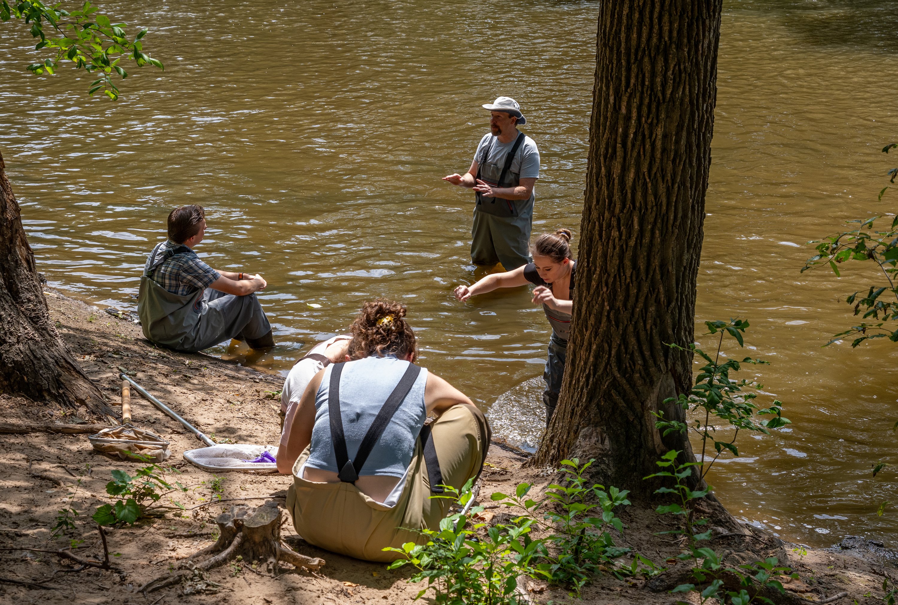 Kevin McCormick?s Organismal and Population Biology course meets in the Red Cedar River to collect a sampling of macroinvertebrates.
