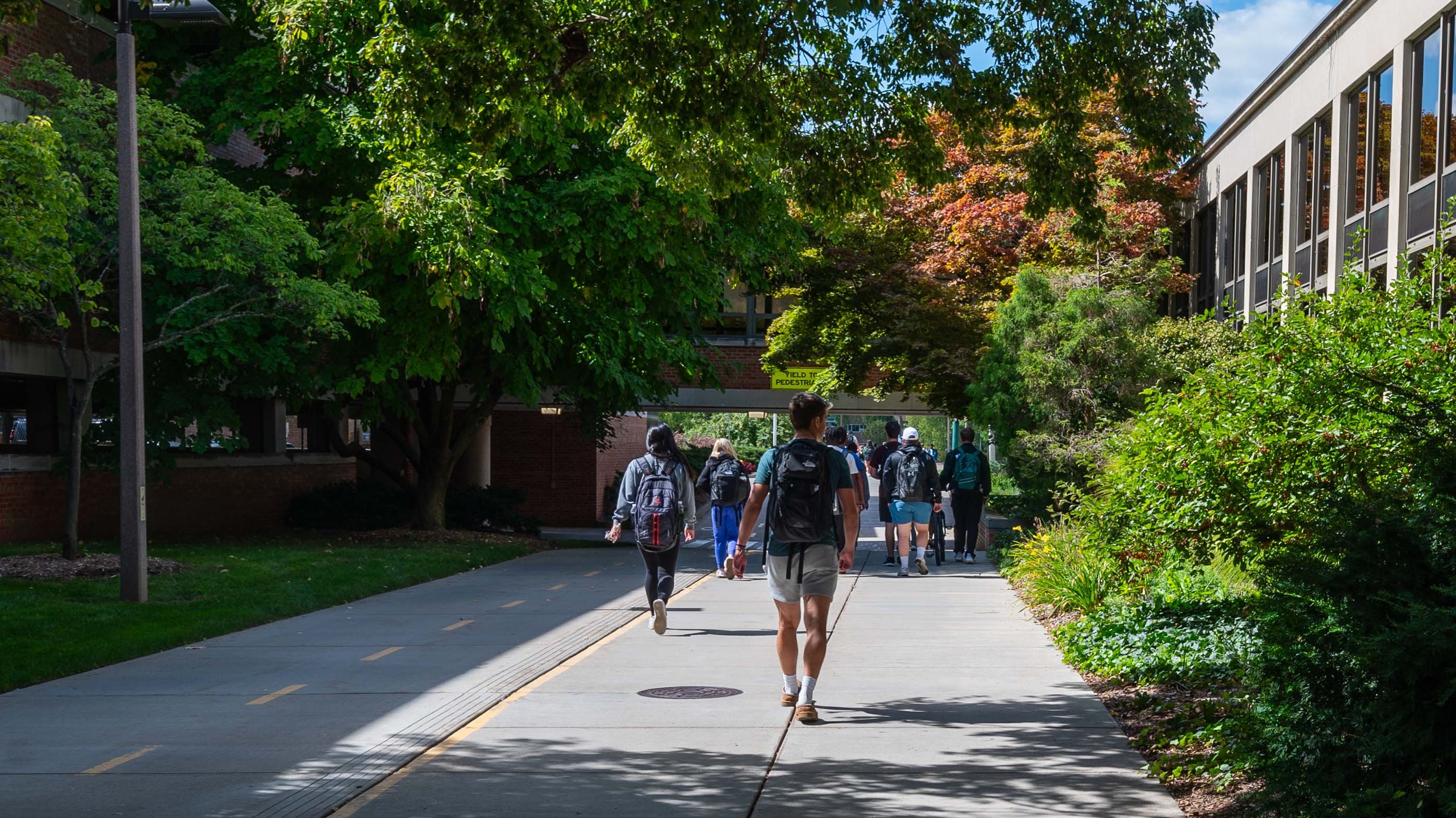 Students passing the Kellogg Hotel and Conference Center