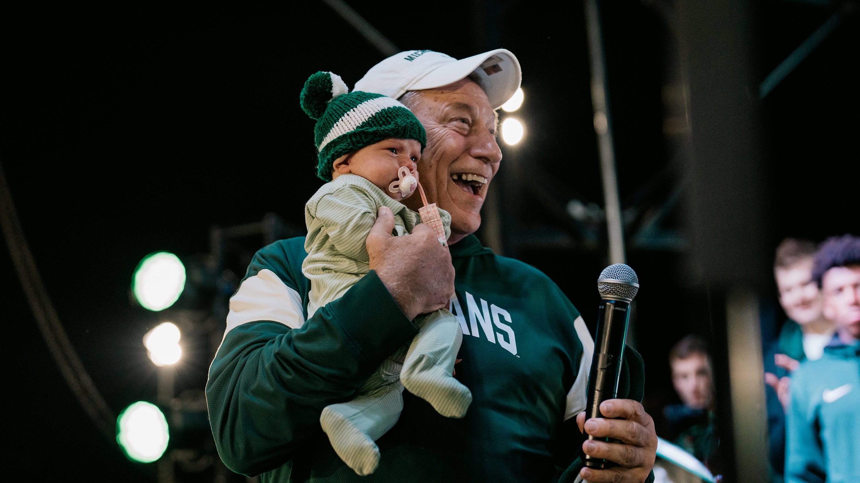 Tom Izzo holding baby