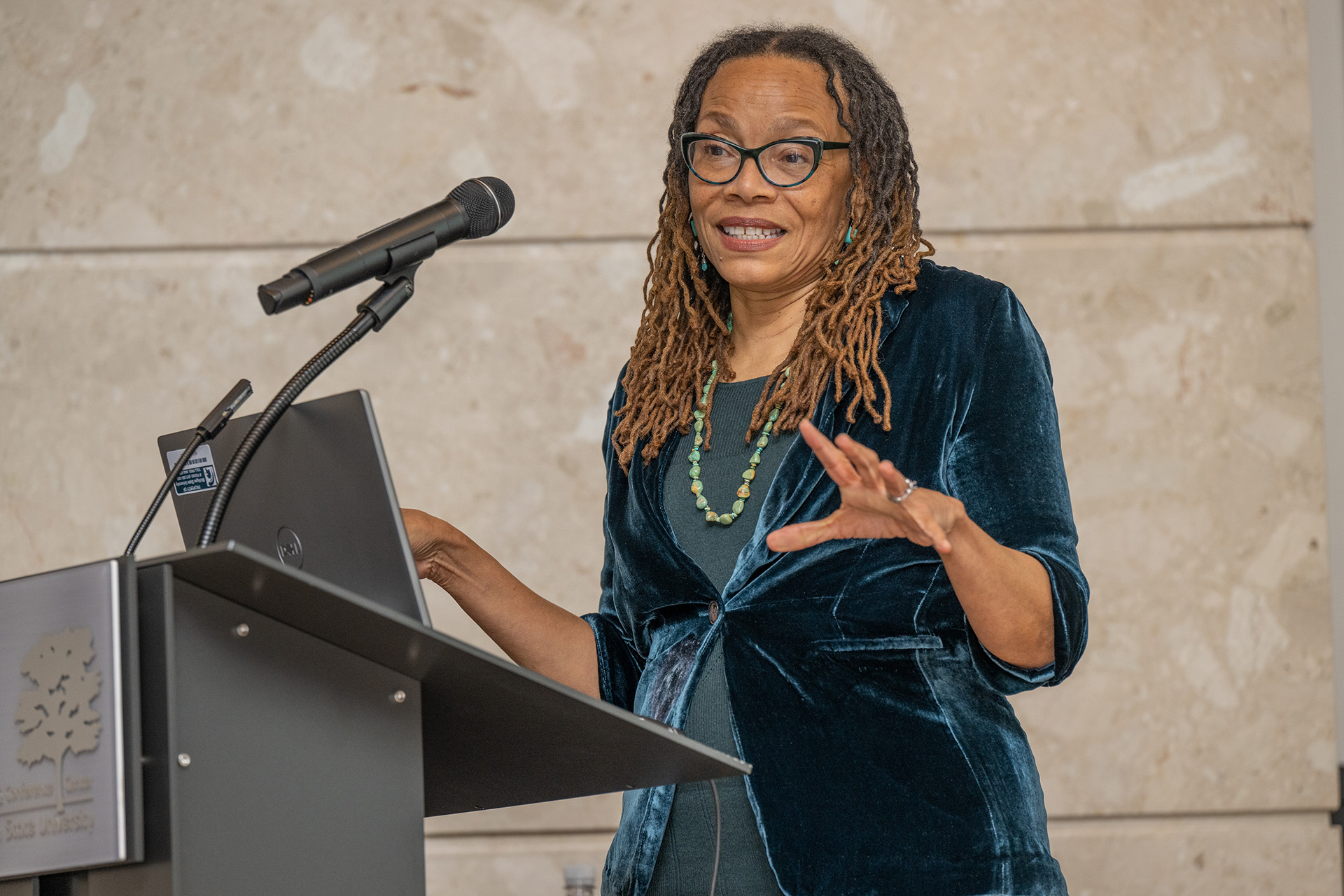 Dorothy Roberts speaking at podium
