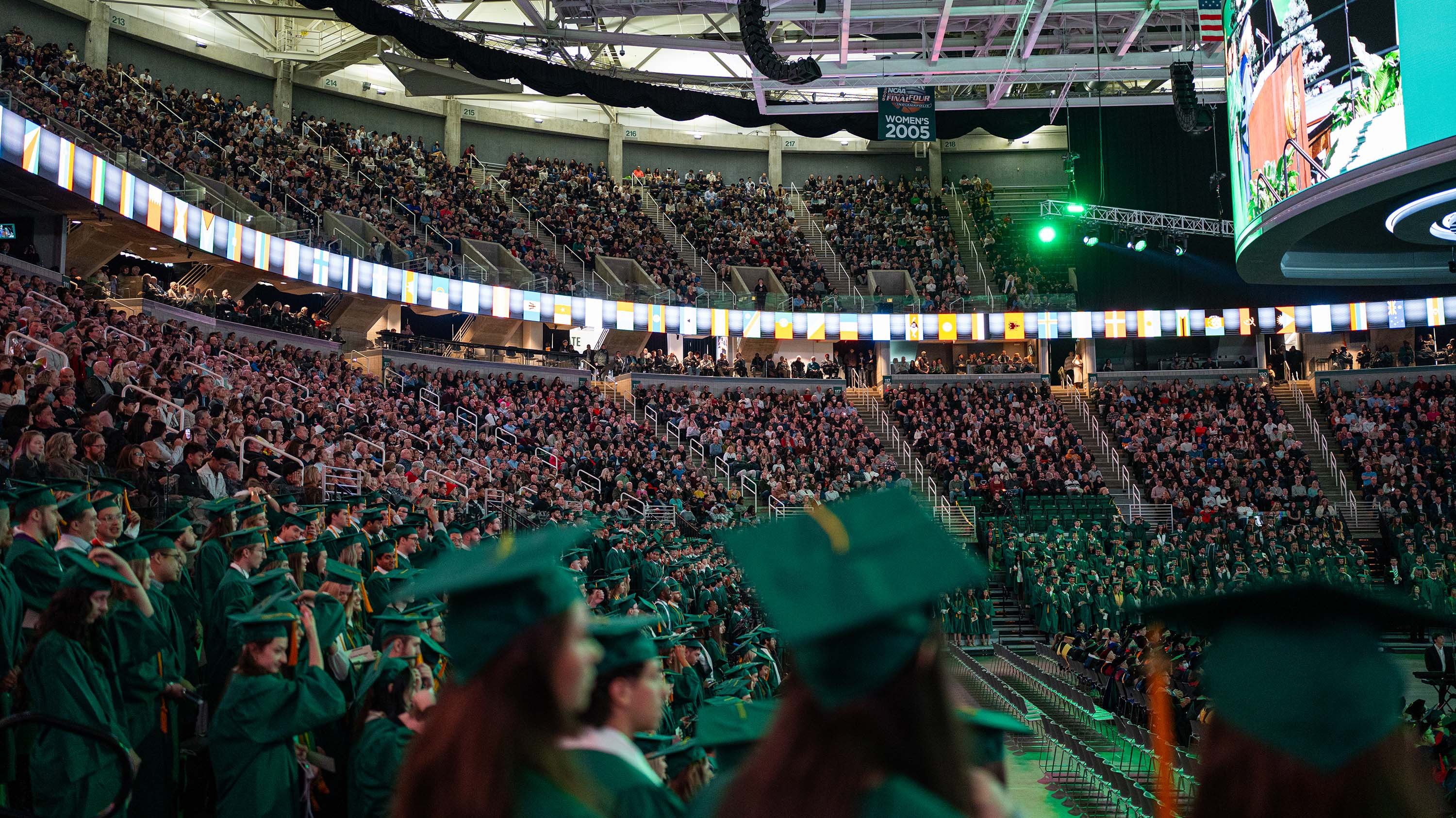 Grads at commencement in Breslin Center