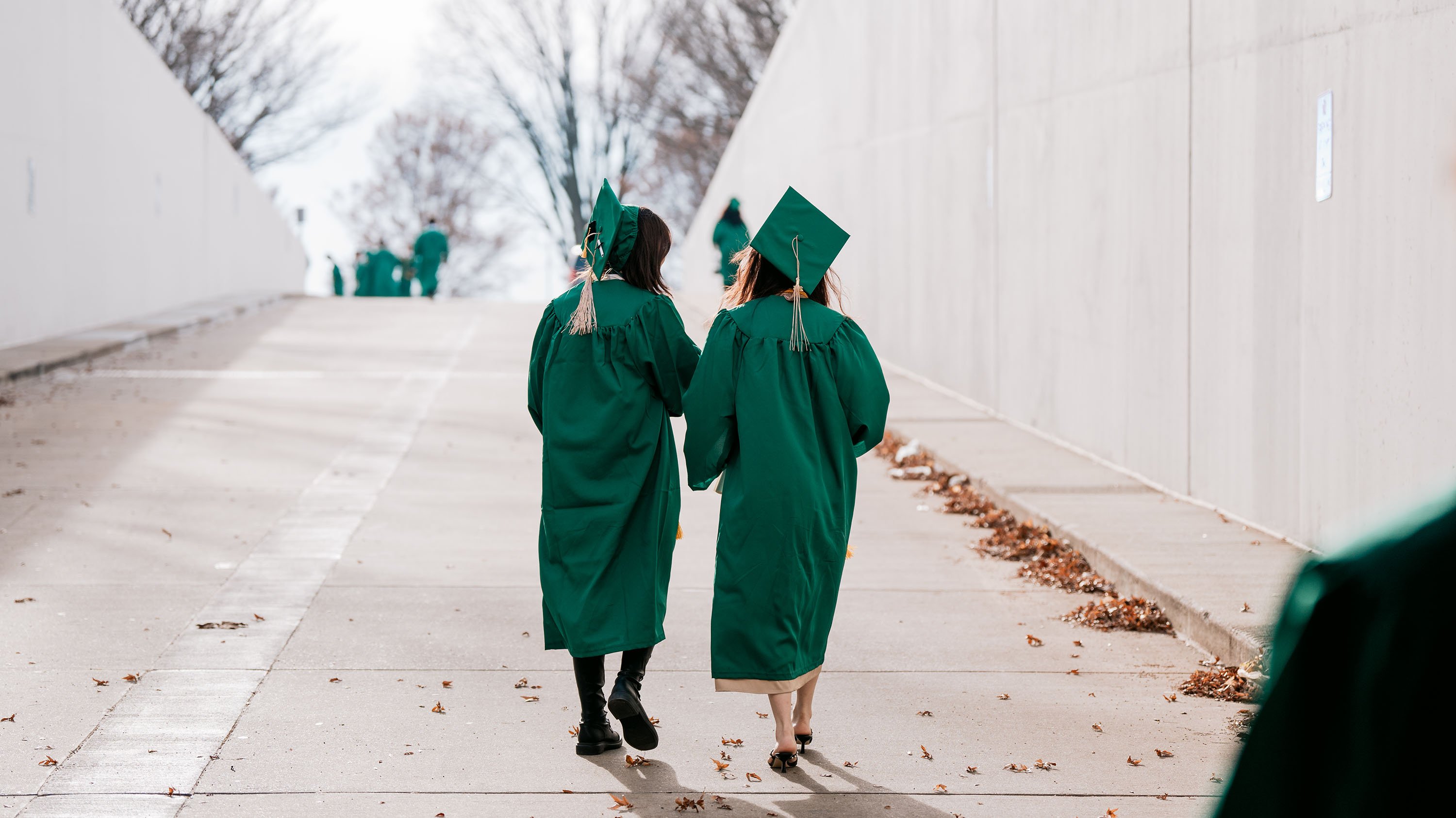 Grads walking out of tunnel in Breslin Center
