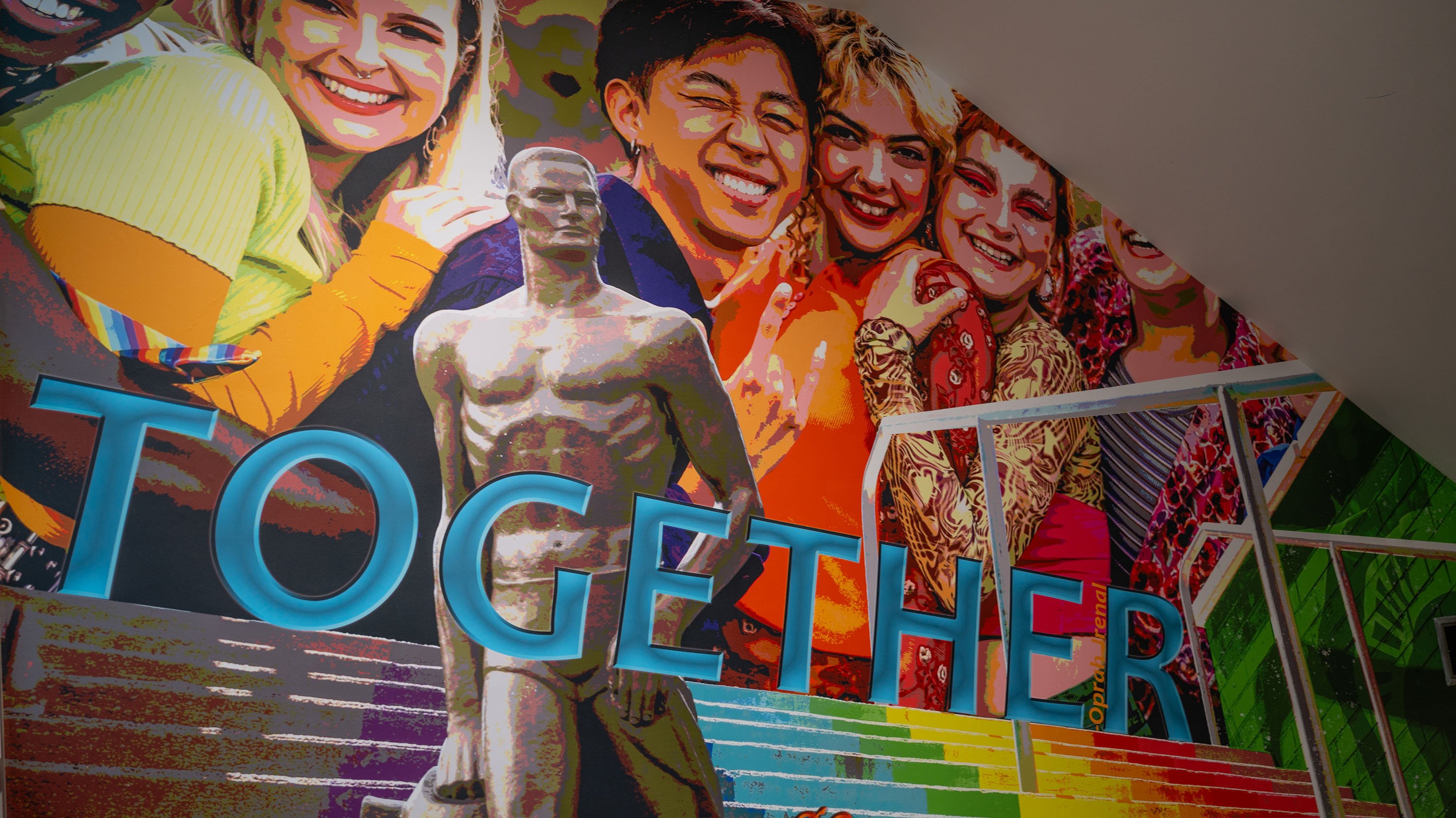 Mural showing students, Spartan Statue and word 'together'