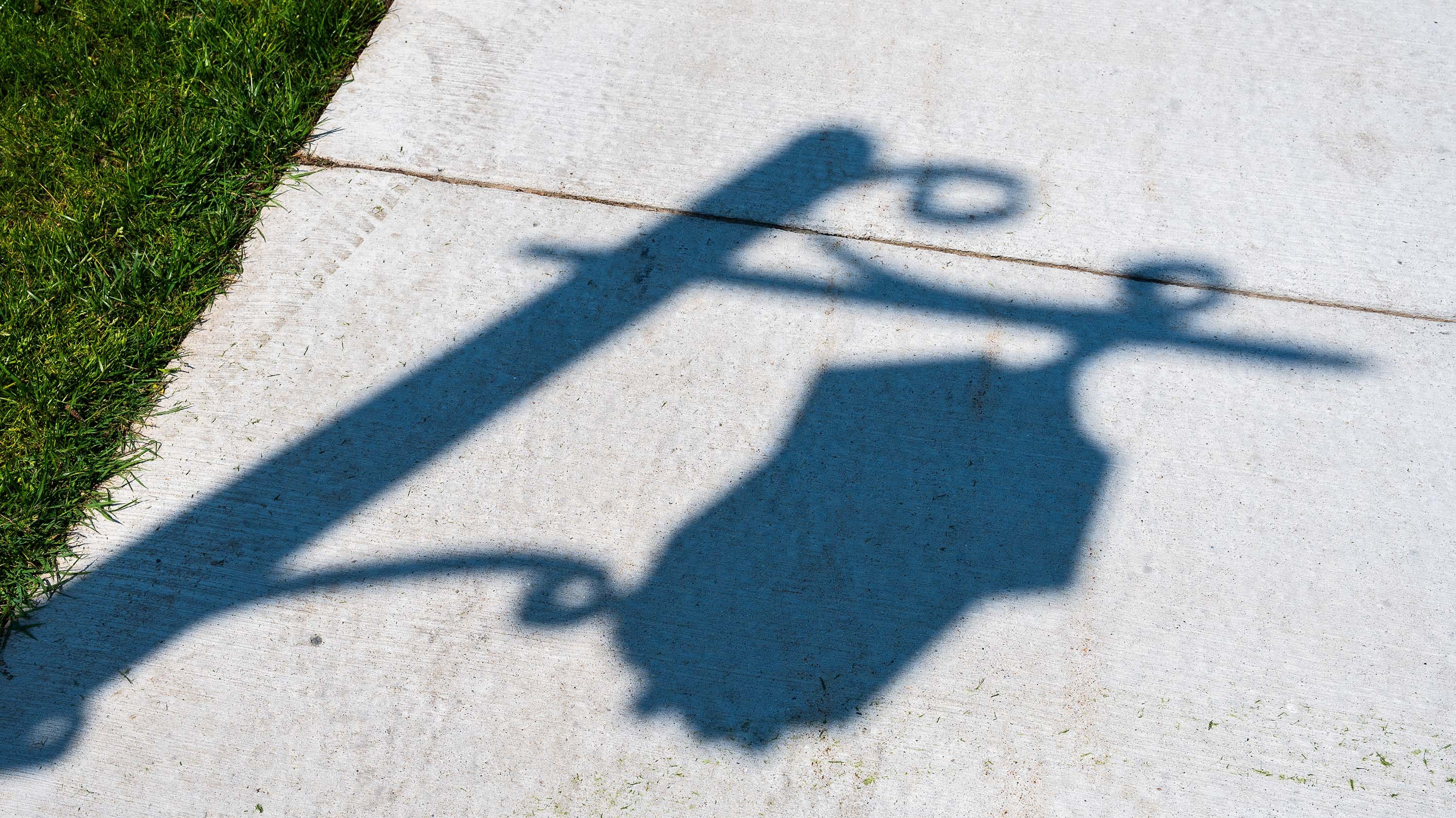 Shadow of MSU lantern on sidewalk
