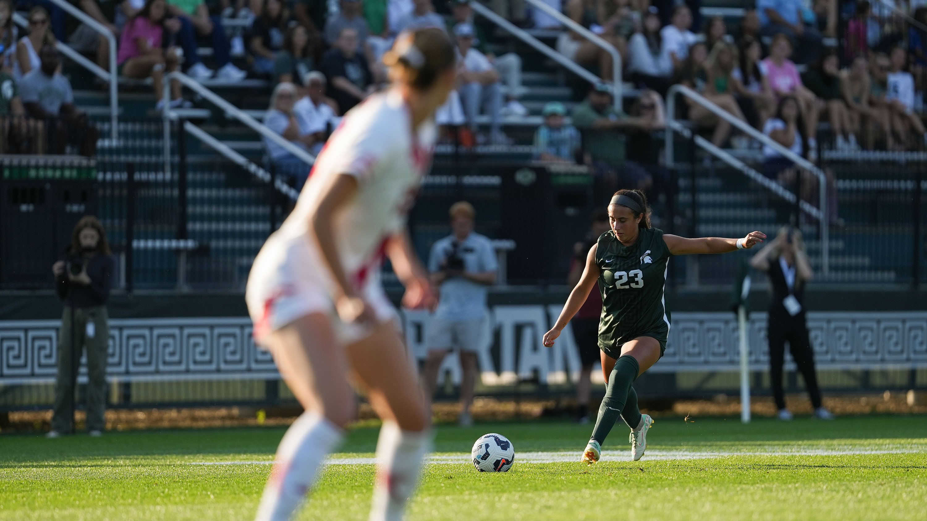 MSU soccer player kicking ball
