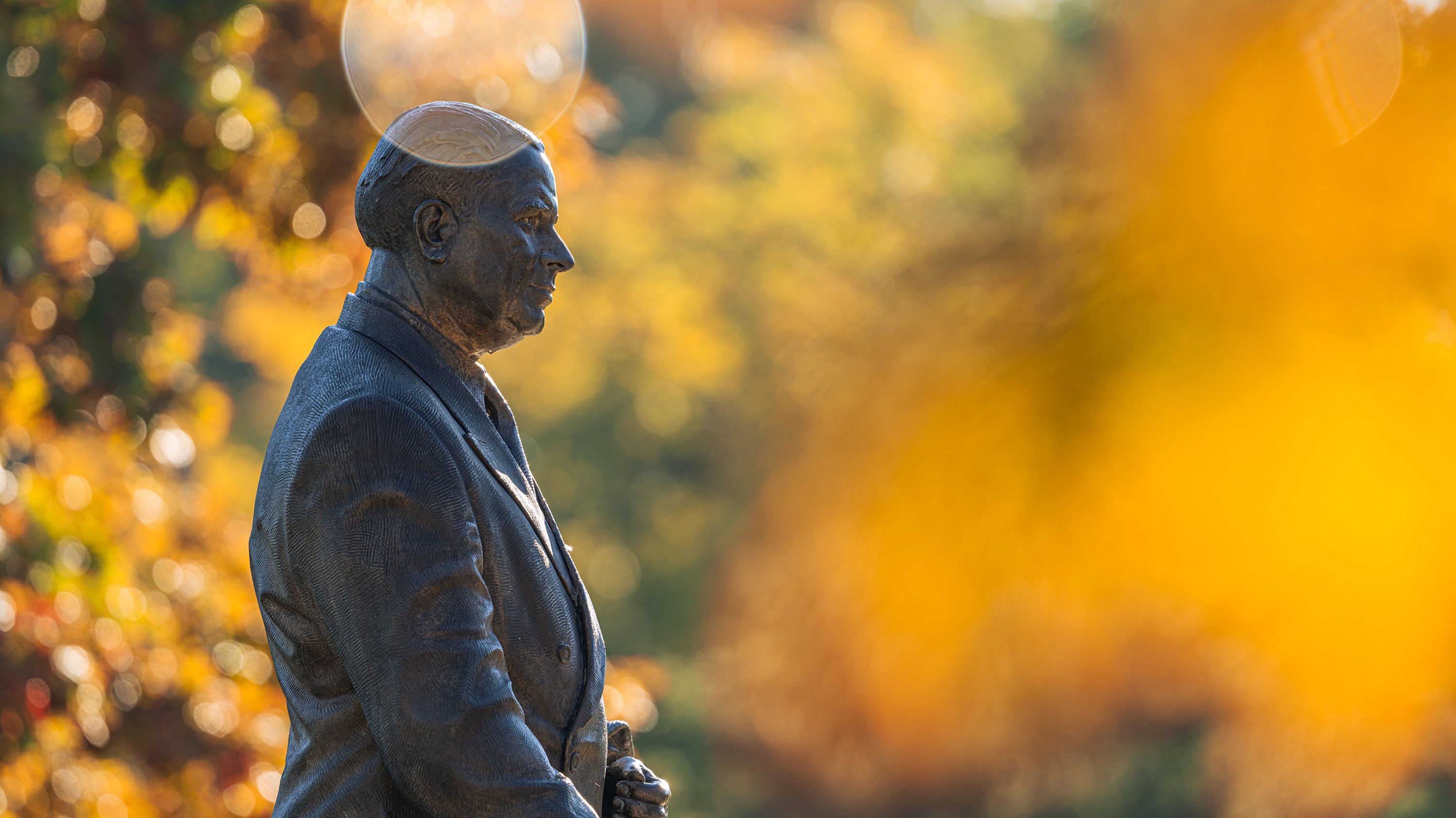 Side view of John Hannah statue in autumn