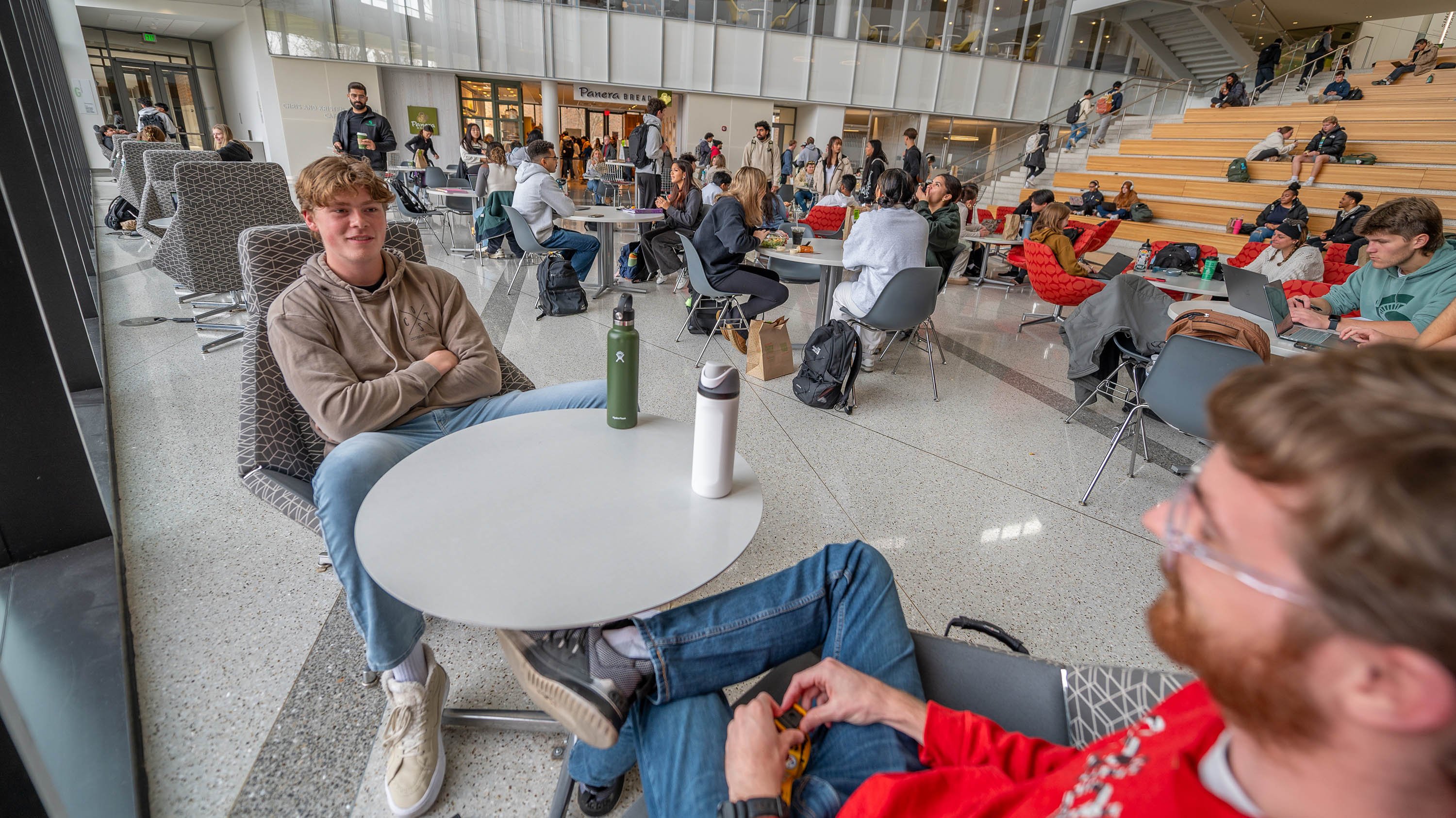 Students sitting at table in Minskoff Pavilion