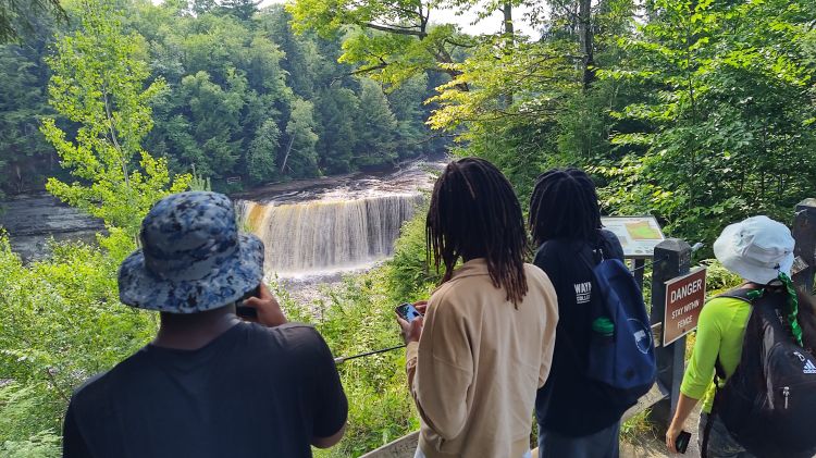 Students at a waterfall