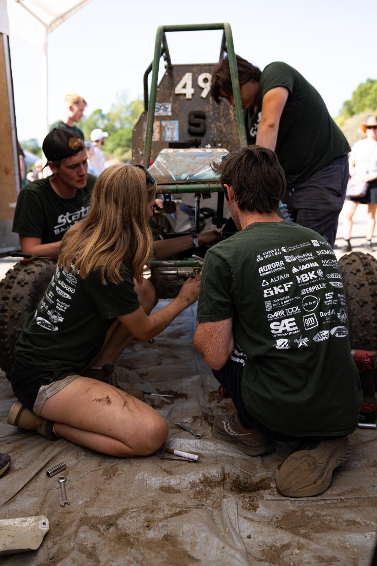 Baja Race Team works together to fix the vehicle
