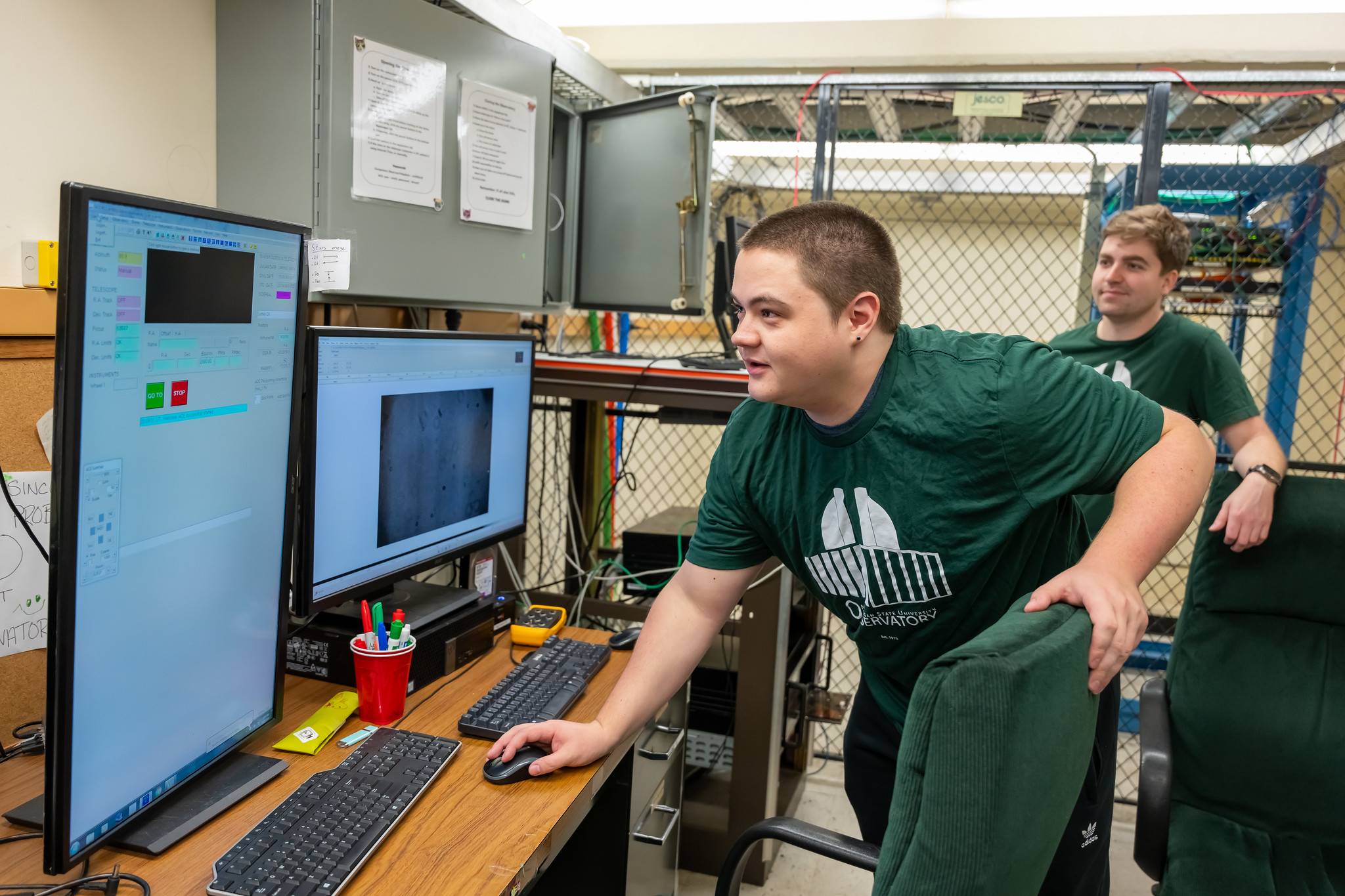 Cameron See and Jack Schulte check the latest images taken by the MSU Observatory telescope camera.