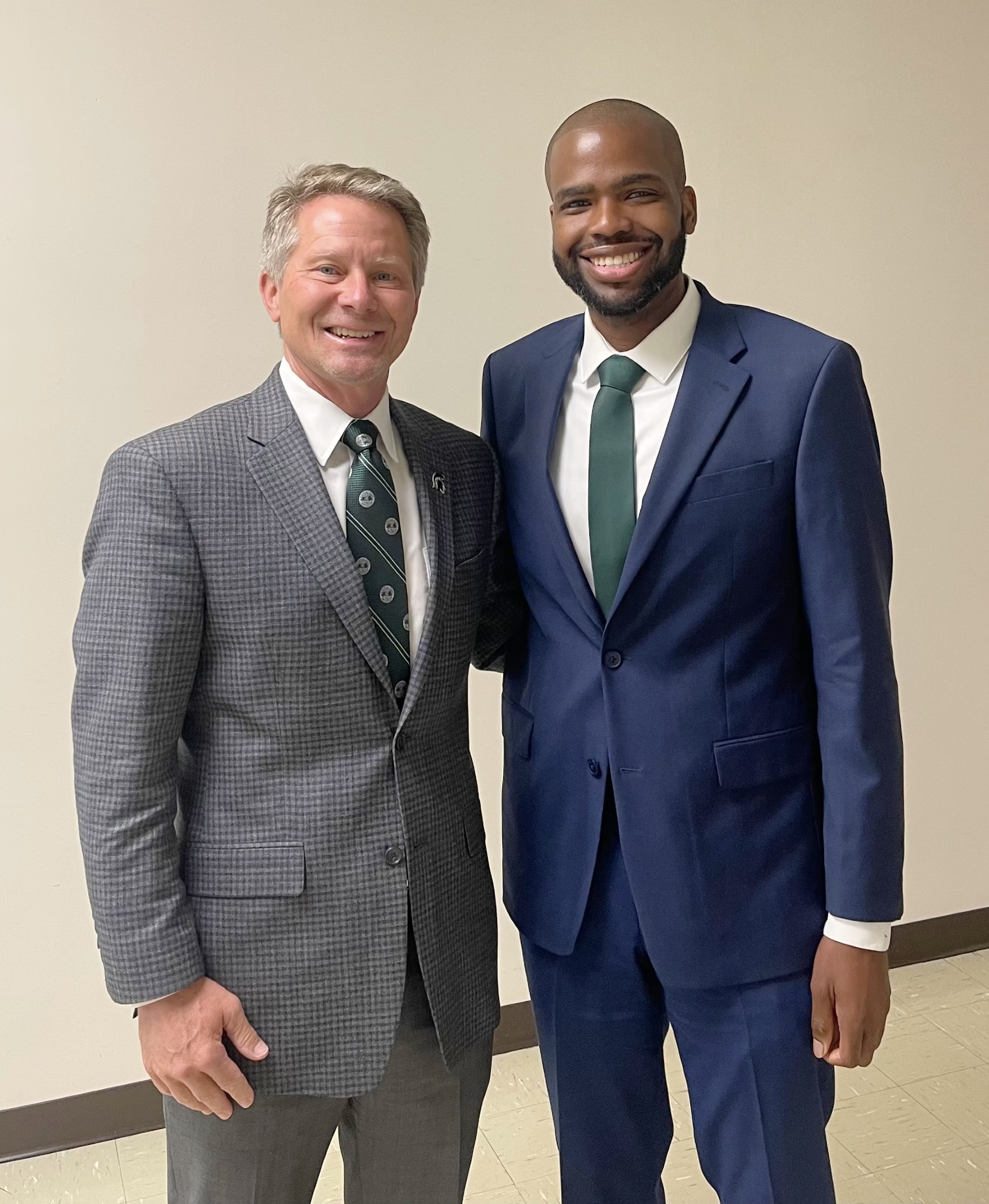 Calvin Wilborn poses with MSU President Kevin Guskiewicz