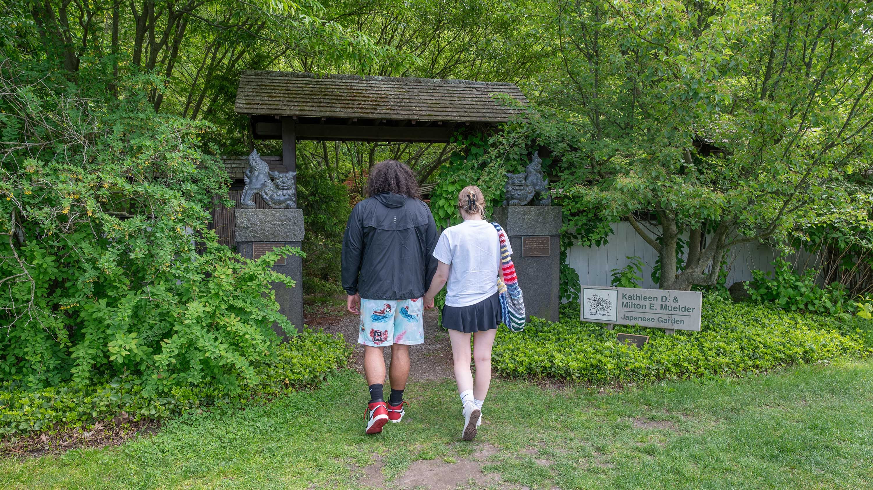 People walking in to the Japanese Garden