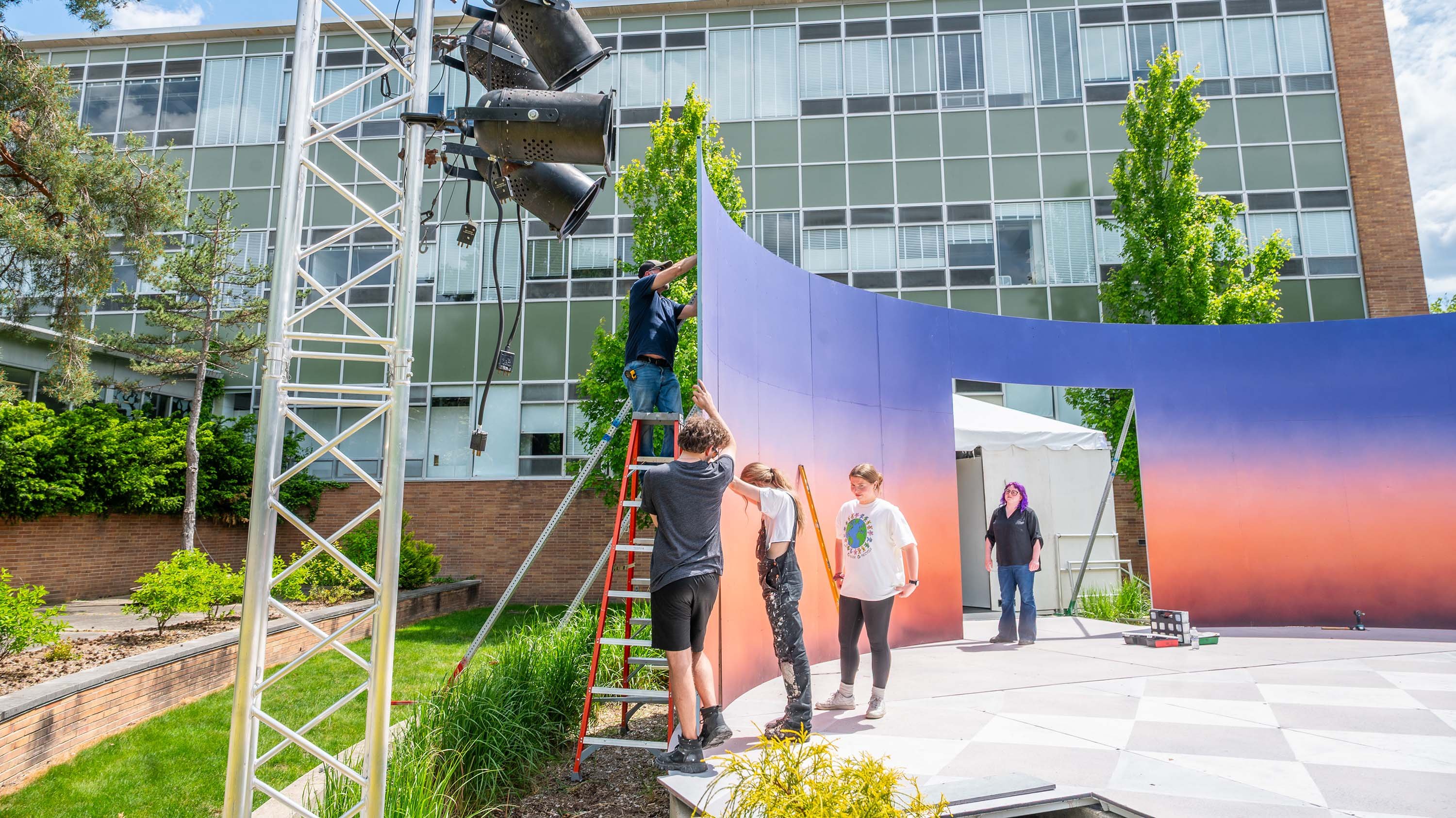 MSU Department of Theatre members setting up a stage for Summer Circle Theater