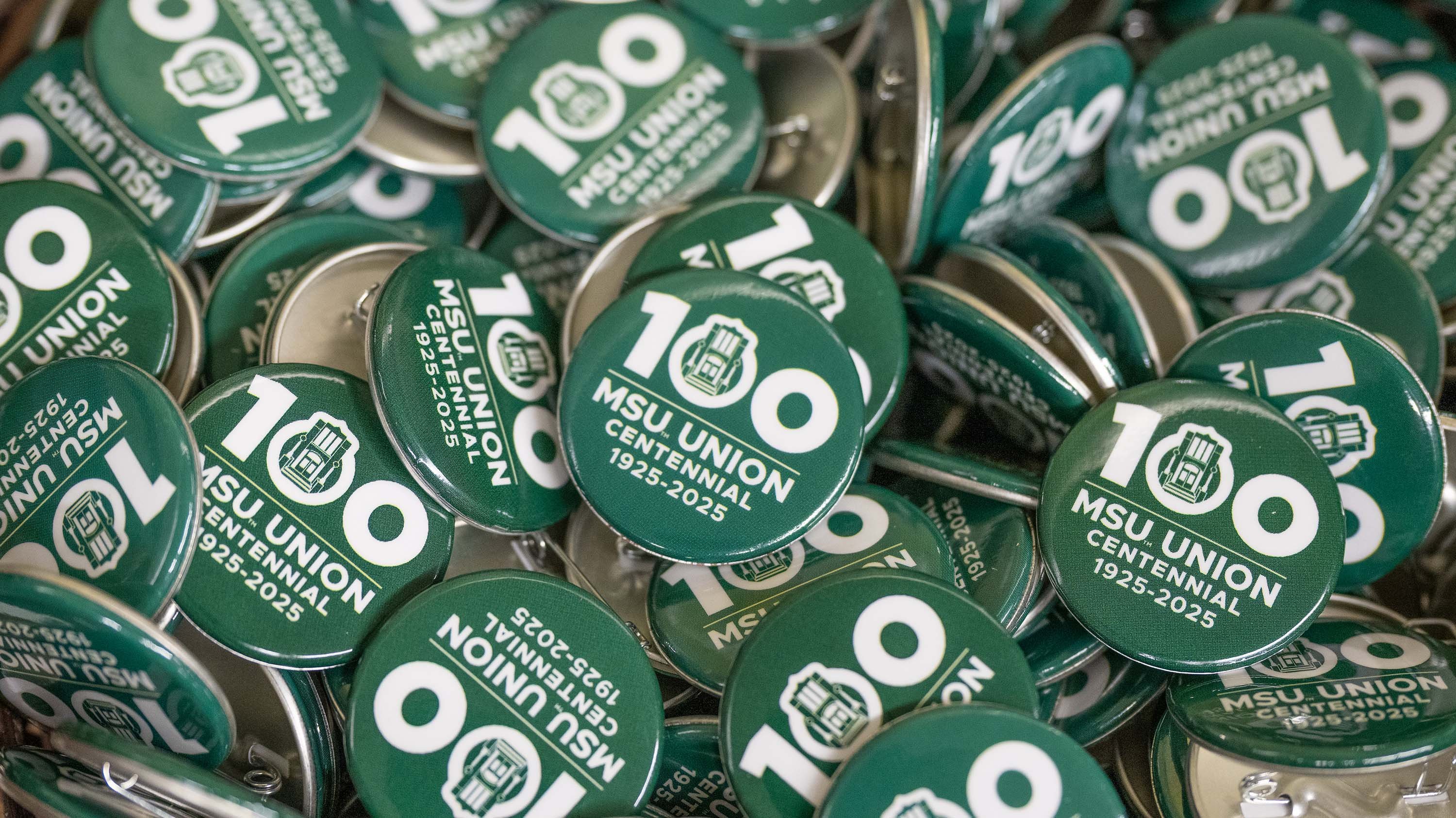 Buttons celebrating 100 years of the MSU Union