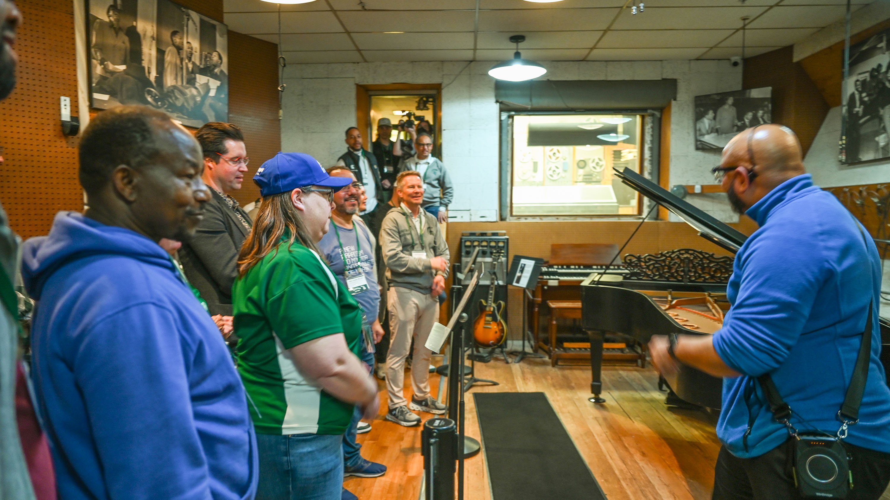 People touring a preserved recording studio