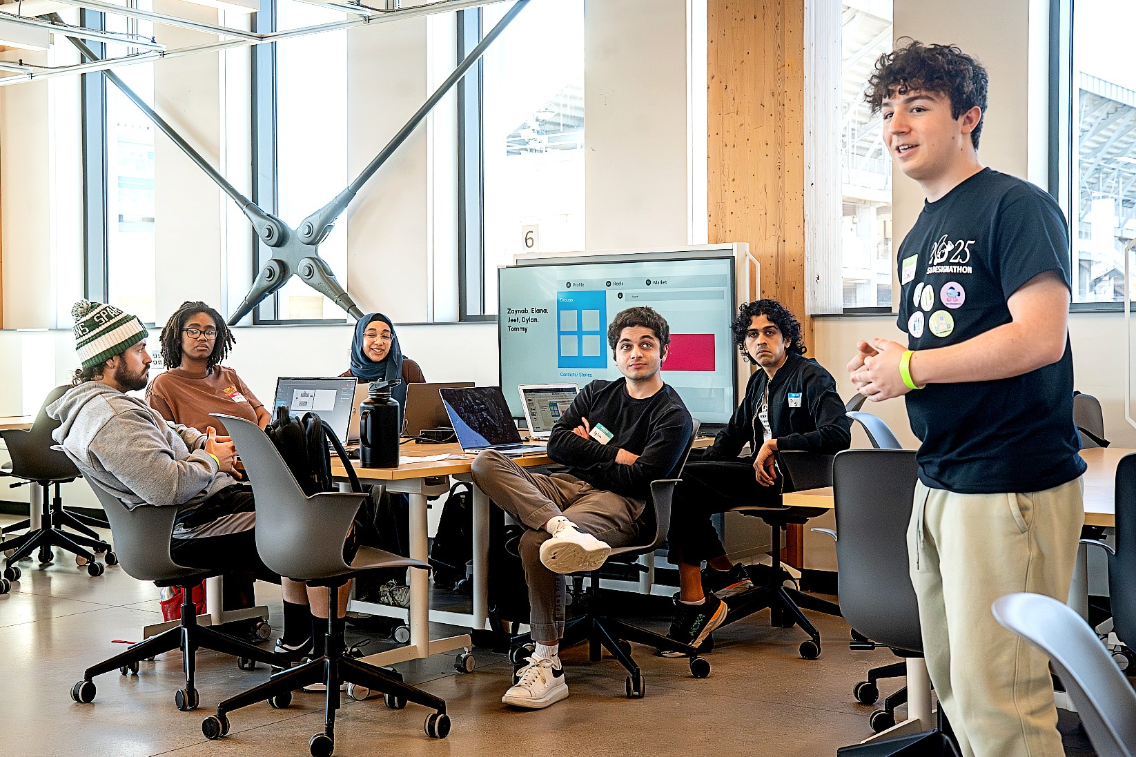 Zach Anderson, Events Team Member, speaking during the Figma Race Workshop, an event where students received hands-on experience in Figma by completing mini design challenges. (Photo by Darrian Chen)