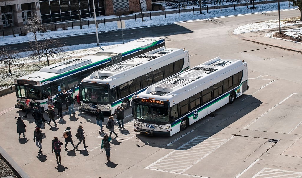 People getting onto the bus