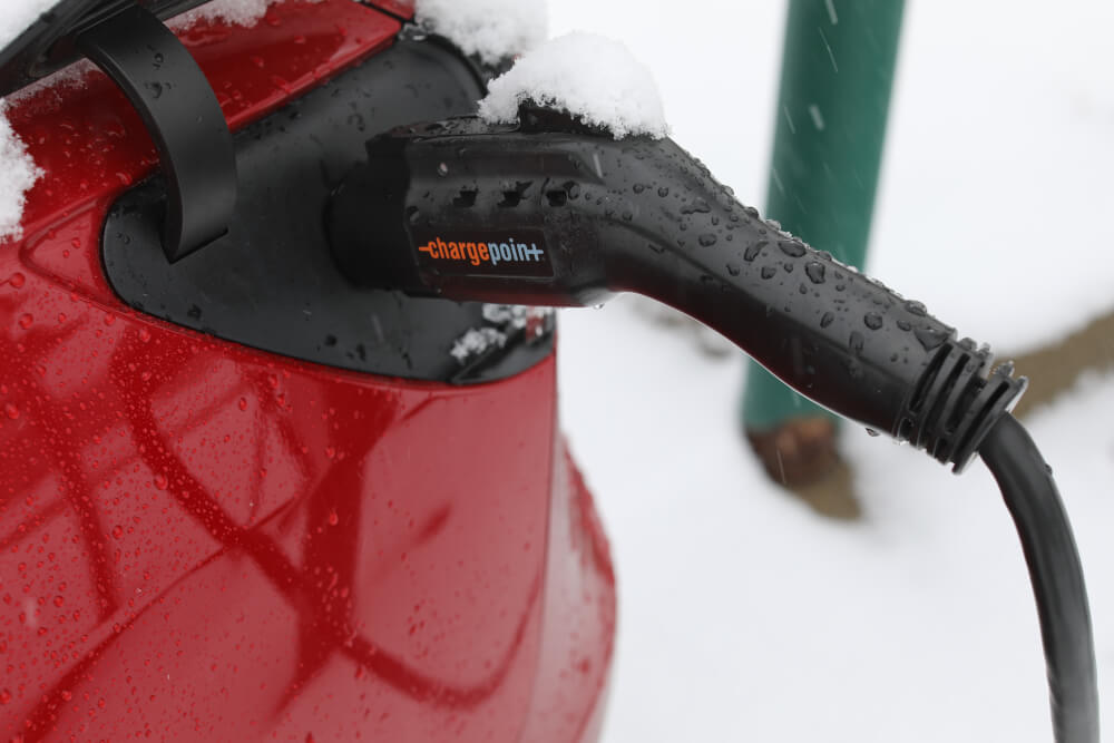 Device connected to an electric vehicle while charging