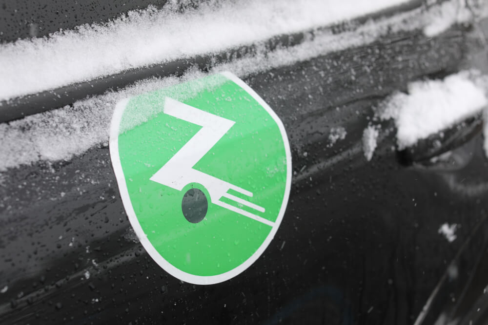 Zipcar logo on the side of a vehicle