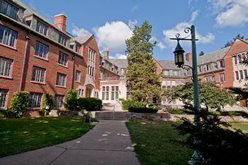 large brick building with lamp post in front