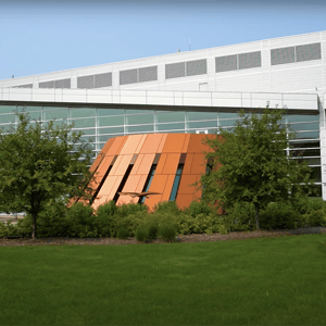 Brody Hall exterior surrounded by green grass. 