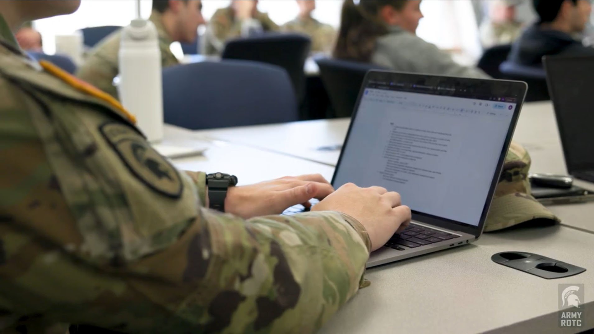 student typing during class