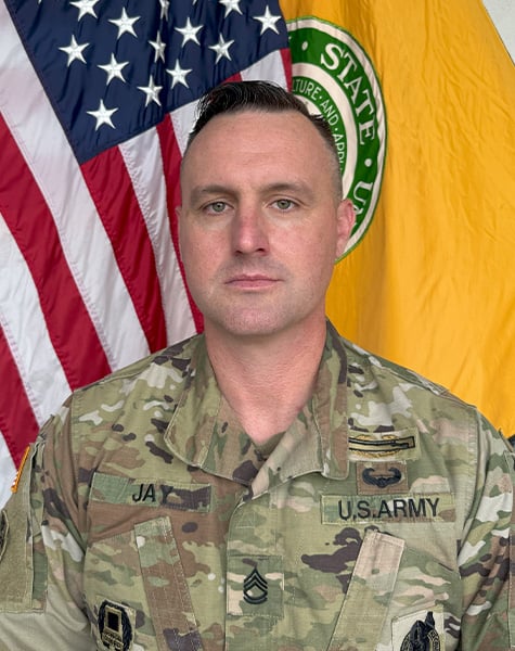 Portrait of Andrew Jay in Army fatigues. 